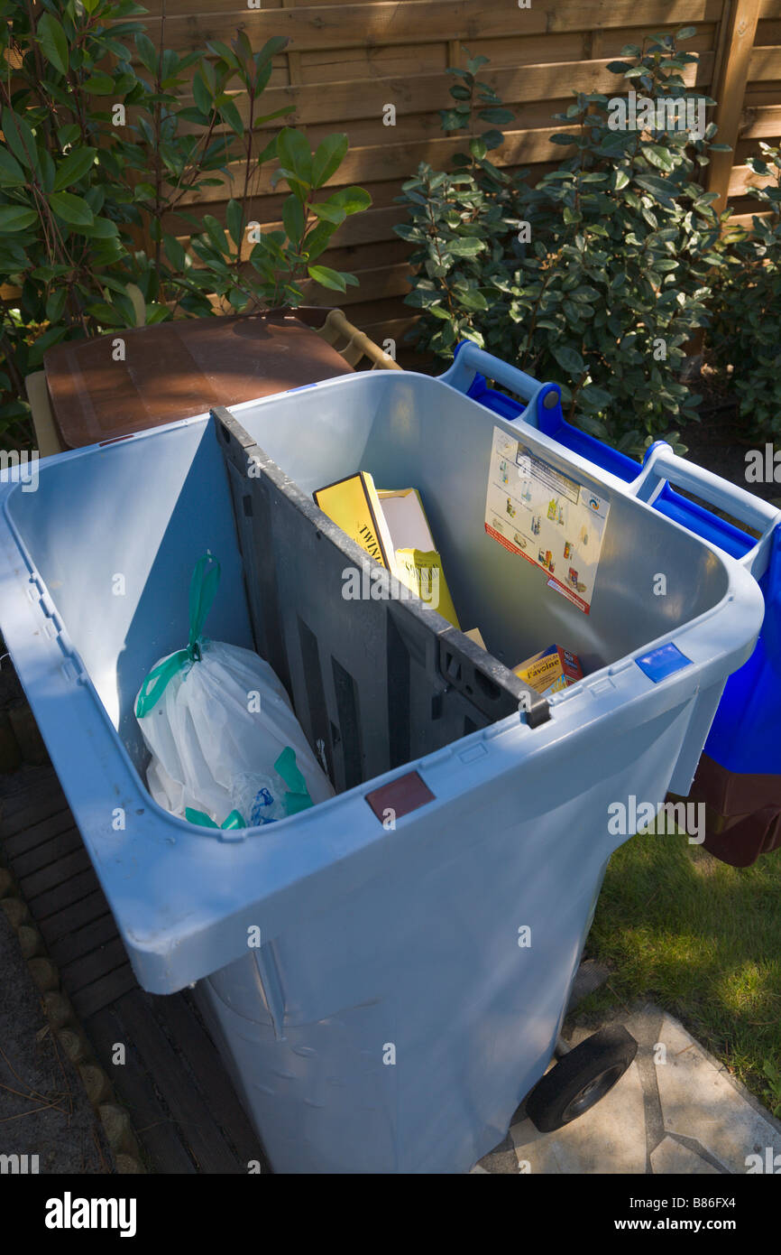 'wheelie bin' partitioned for recycled items, France Stock Photo