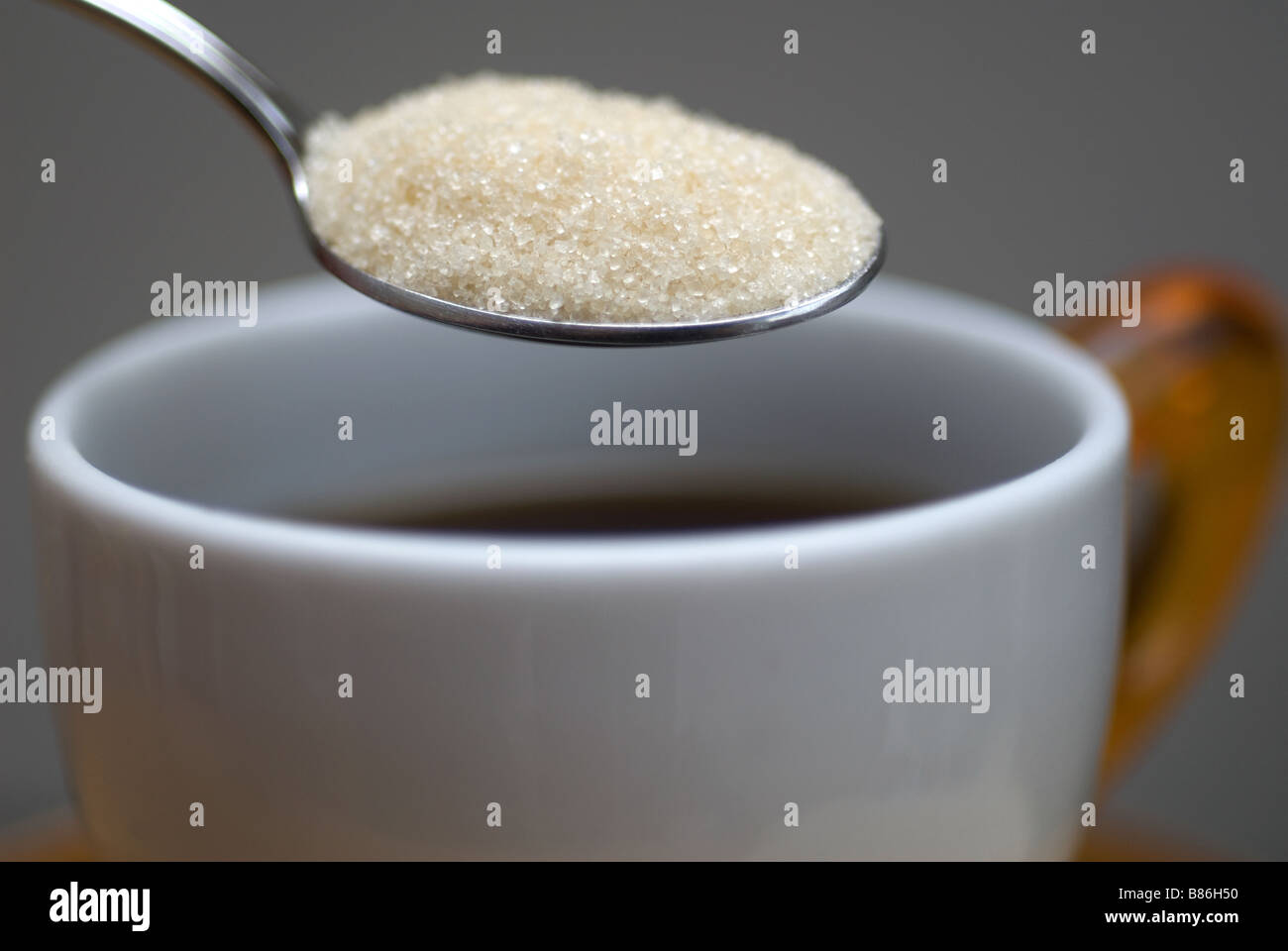 Sugar spoon with cup of coffee Stock Photo