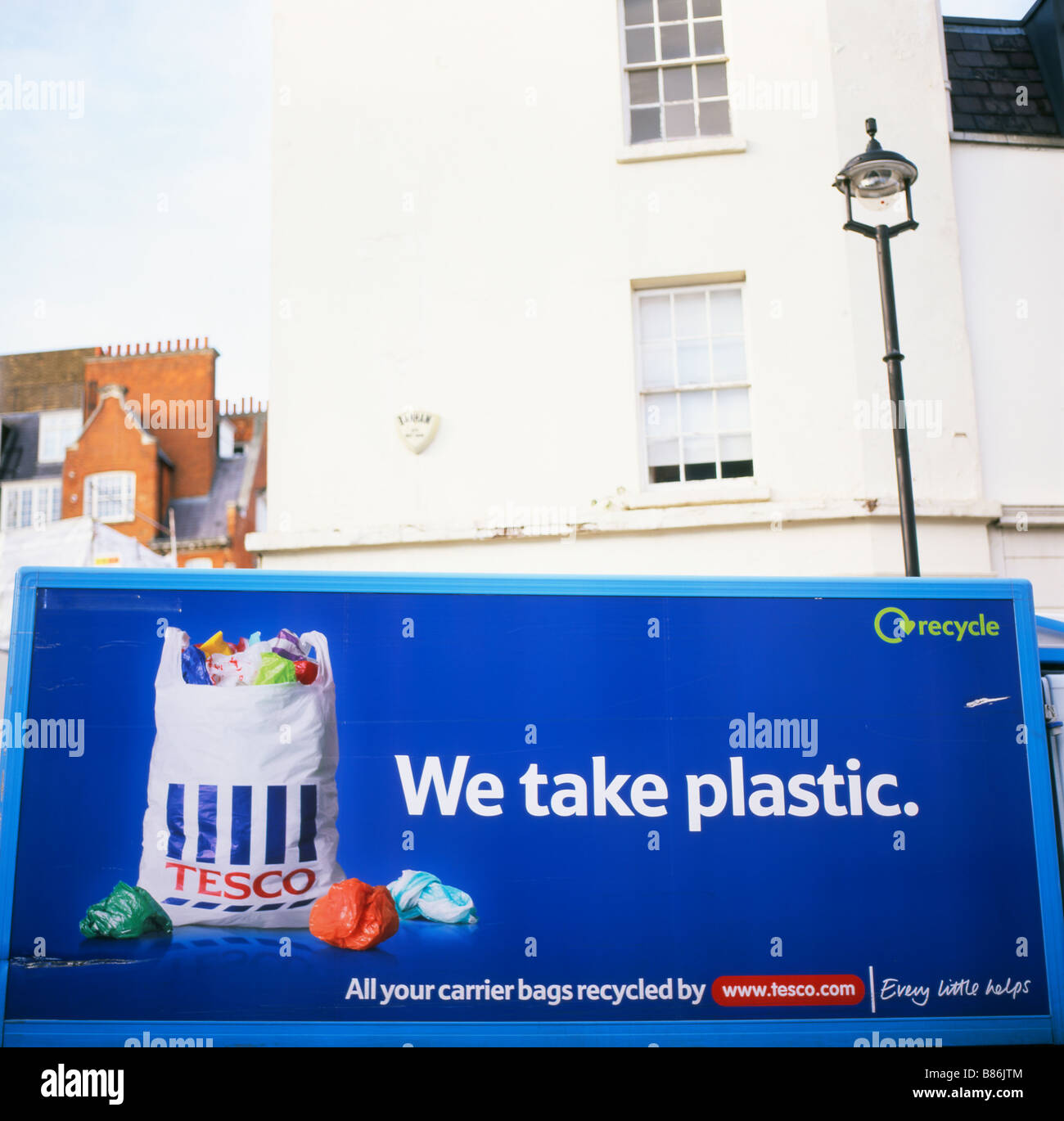 The side of Tesco delivery lorry with a recycling plastic bag message 'We take plastic' parked in a street in London England UK 2008  KATHY DEWITT Stock Photo