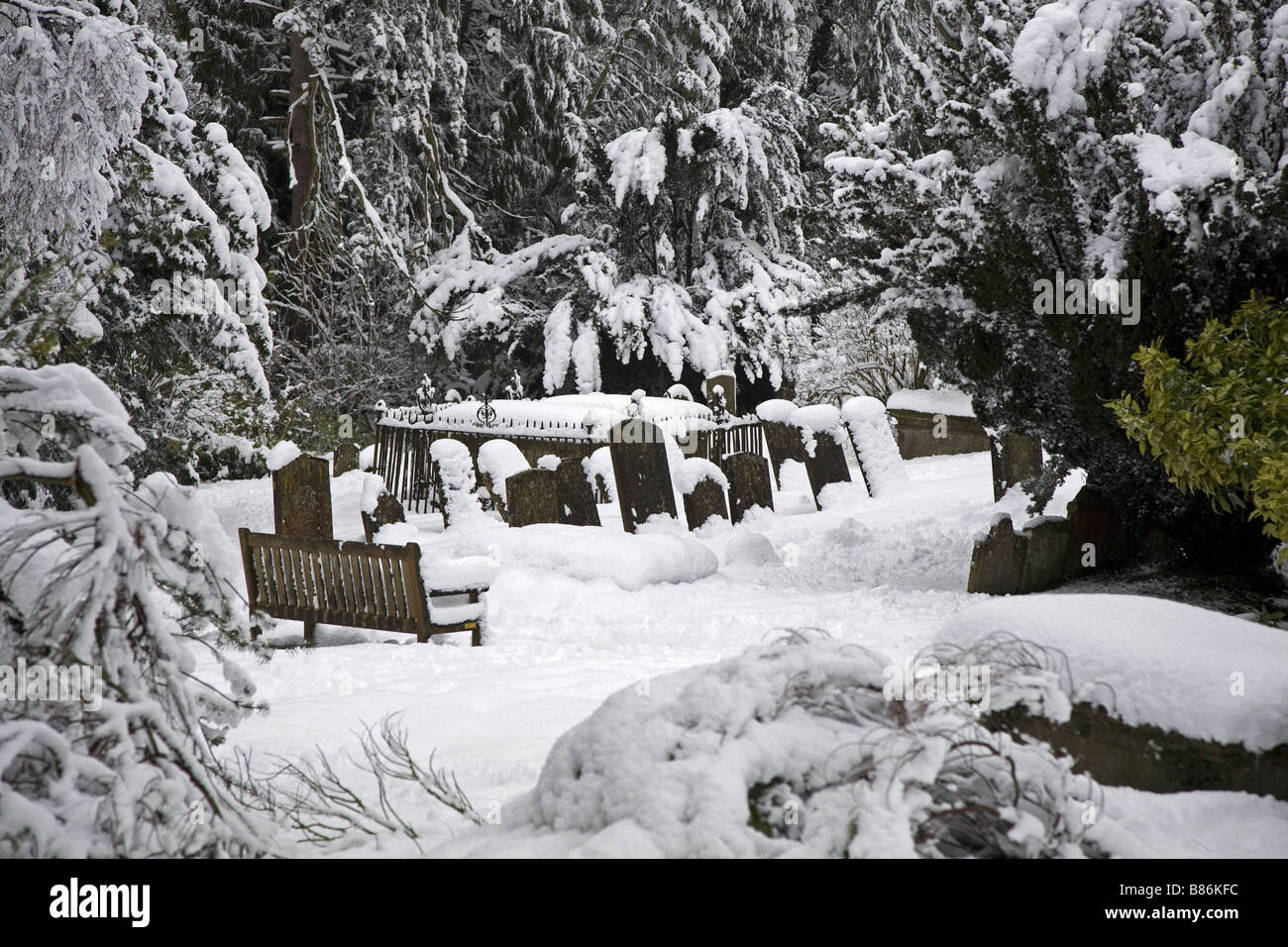 Snow covered Church Graveyard in Oxfordshire. Stock Photo