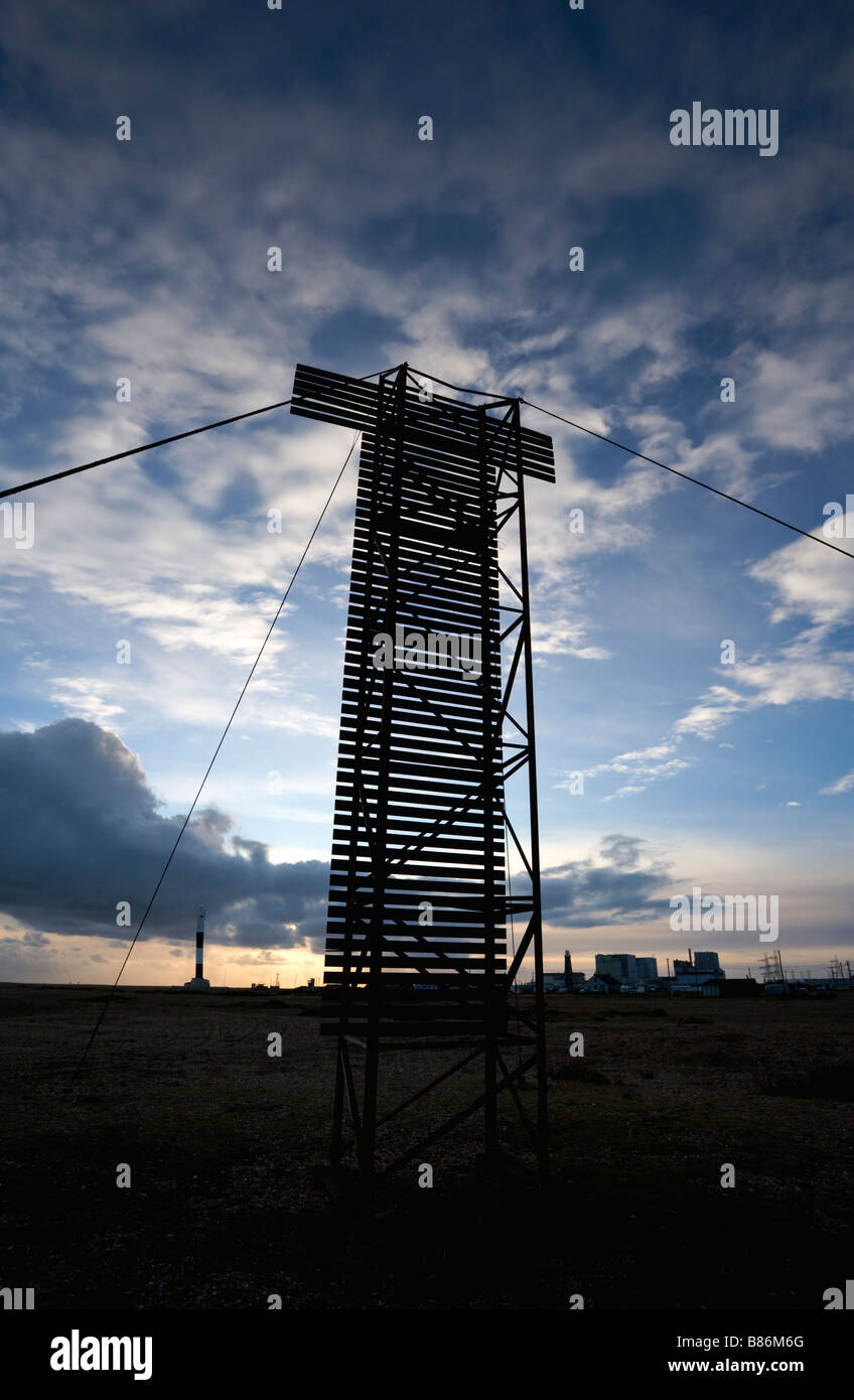 A massive tall high structure silhouetted against a Winter sky at Dungeness in Kent Stock Photo