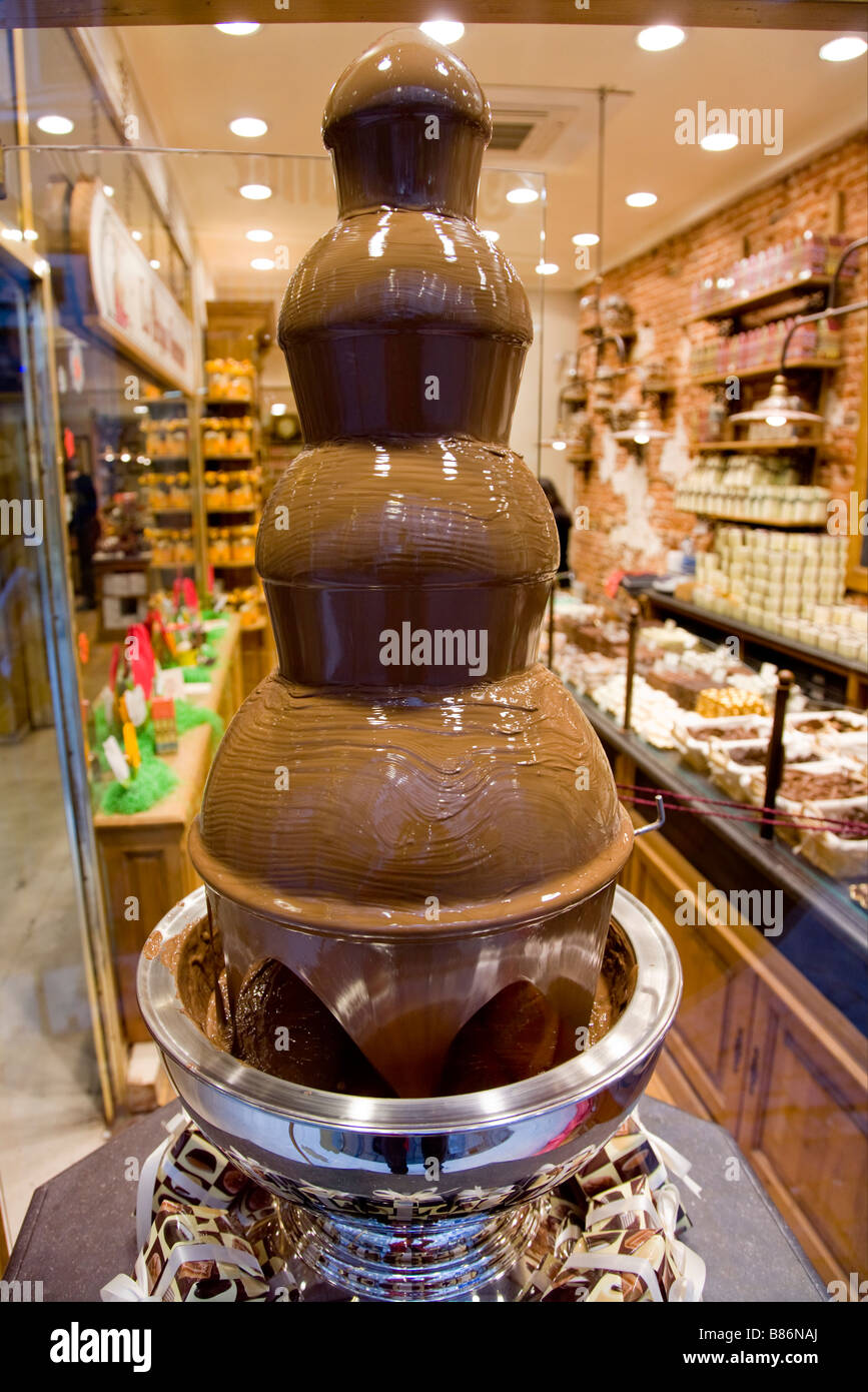 Chocolate fountain waterfall in window display at Rogier Belgian