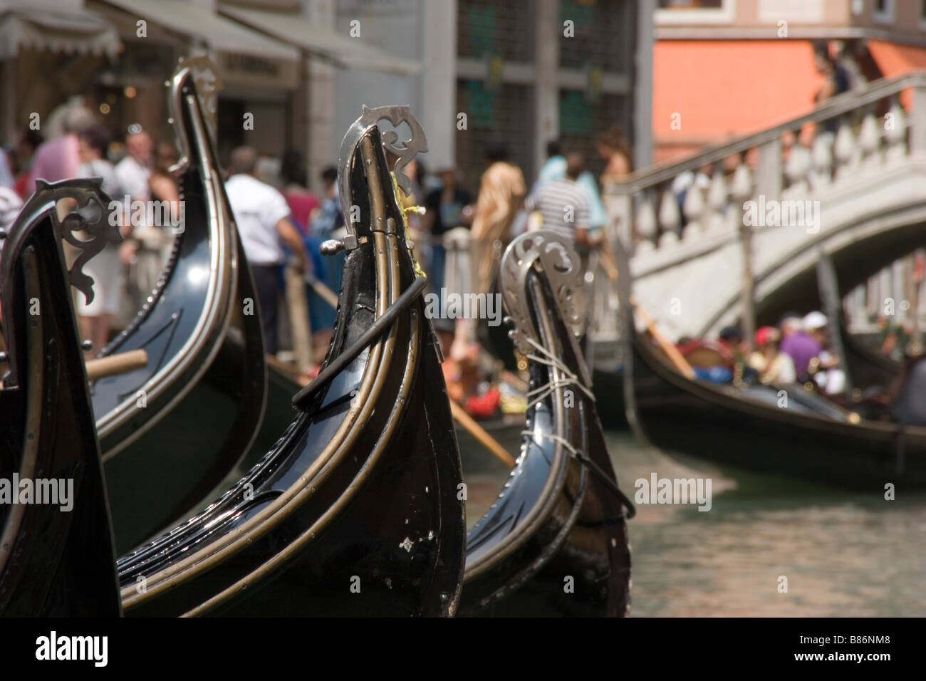 Venice Italy gondolas wait for passengers before gondoliers embark on tours of the city's famous canals. Stock Photo