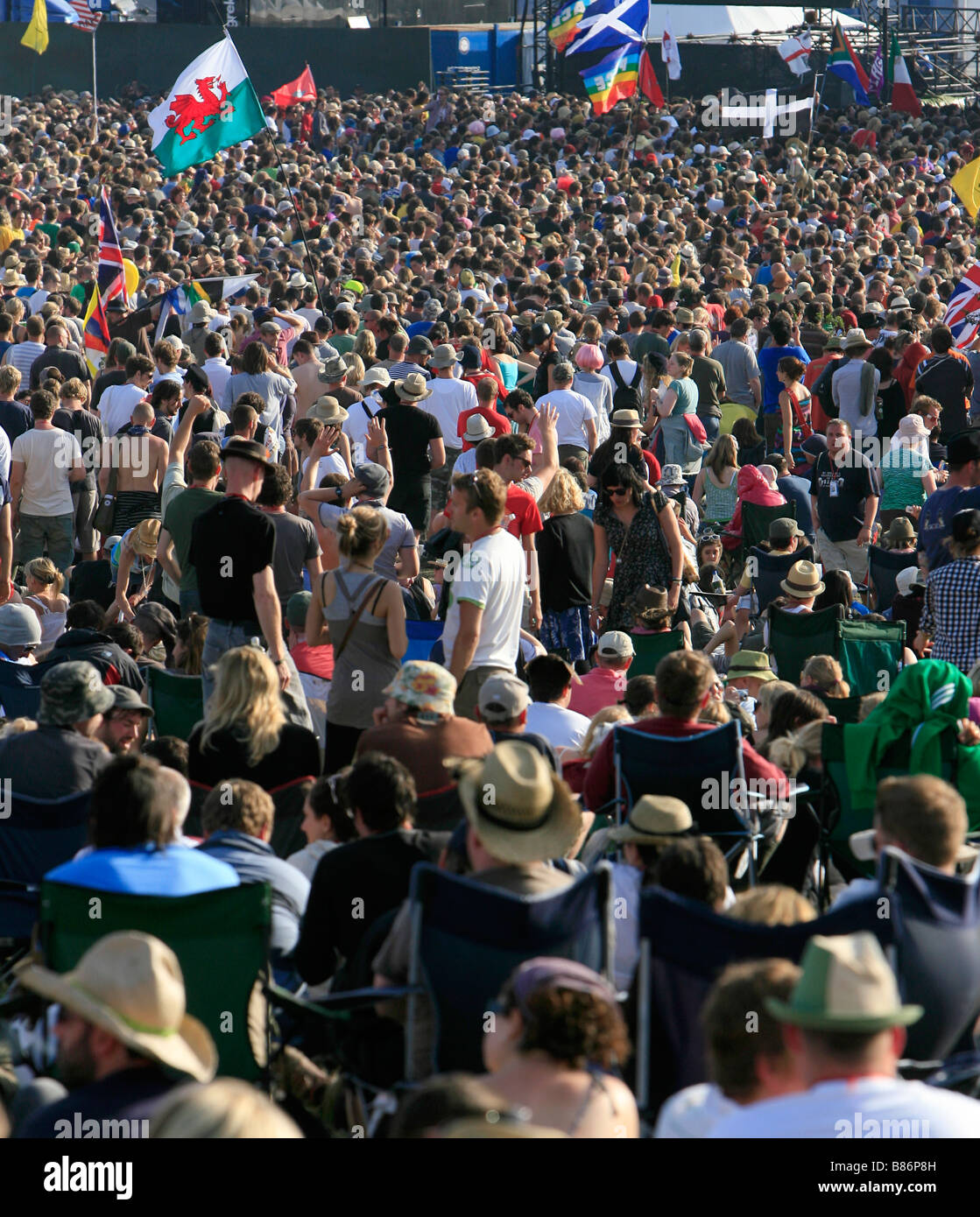 Crowds gather in front of the pyramid stage at the Glastonbury Festival in Pilton, Somerset. Stock Photo