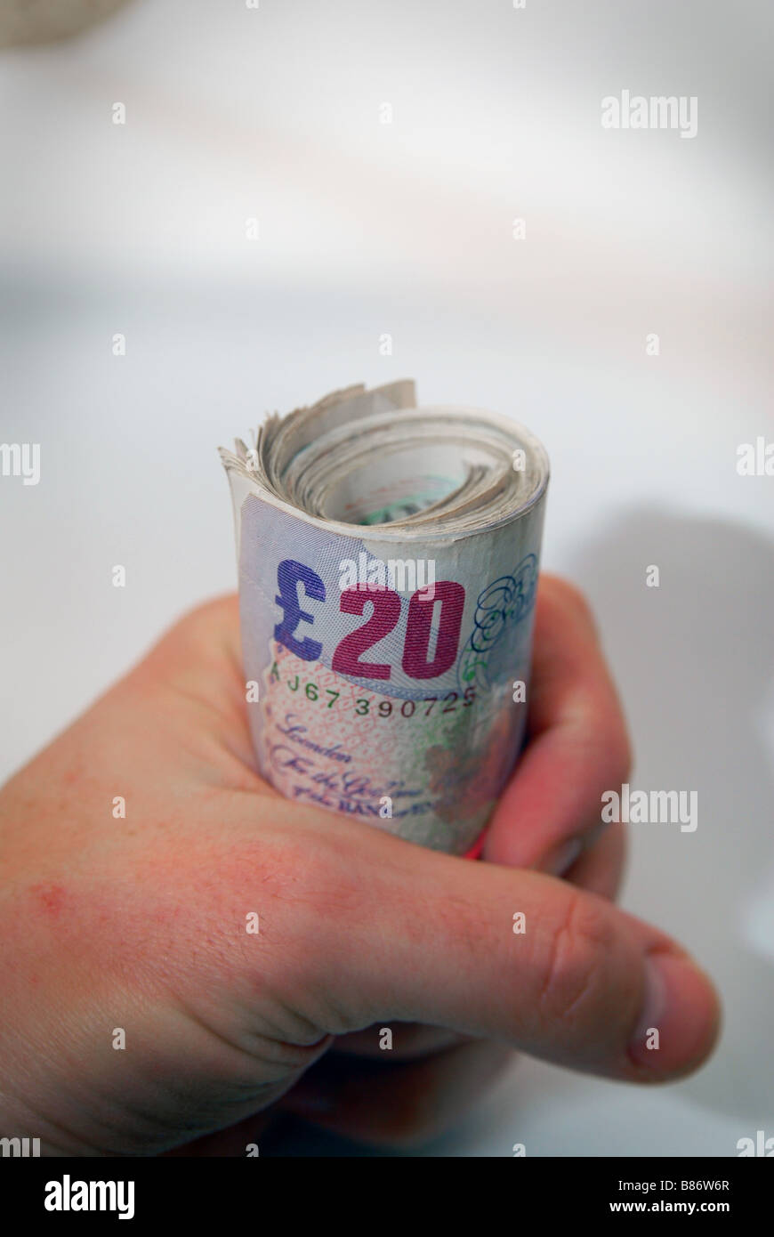 A roll of used £20 Stirling bank notes, used notes ( currency money