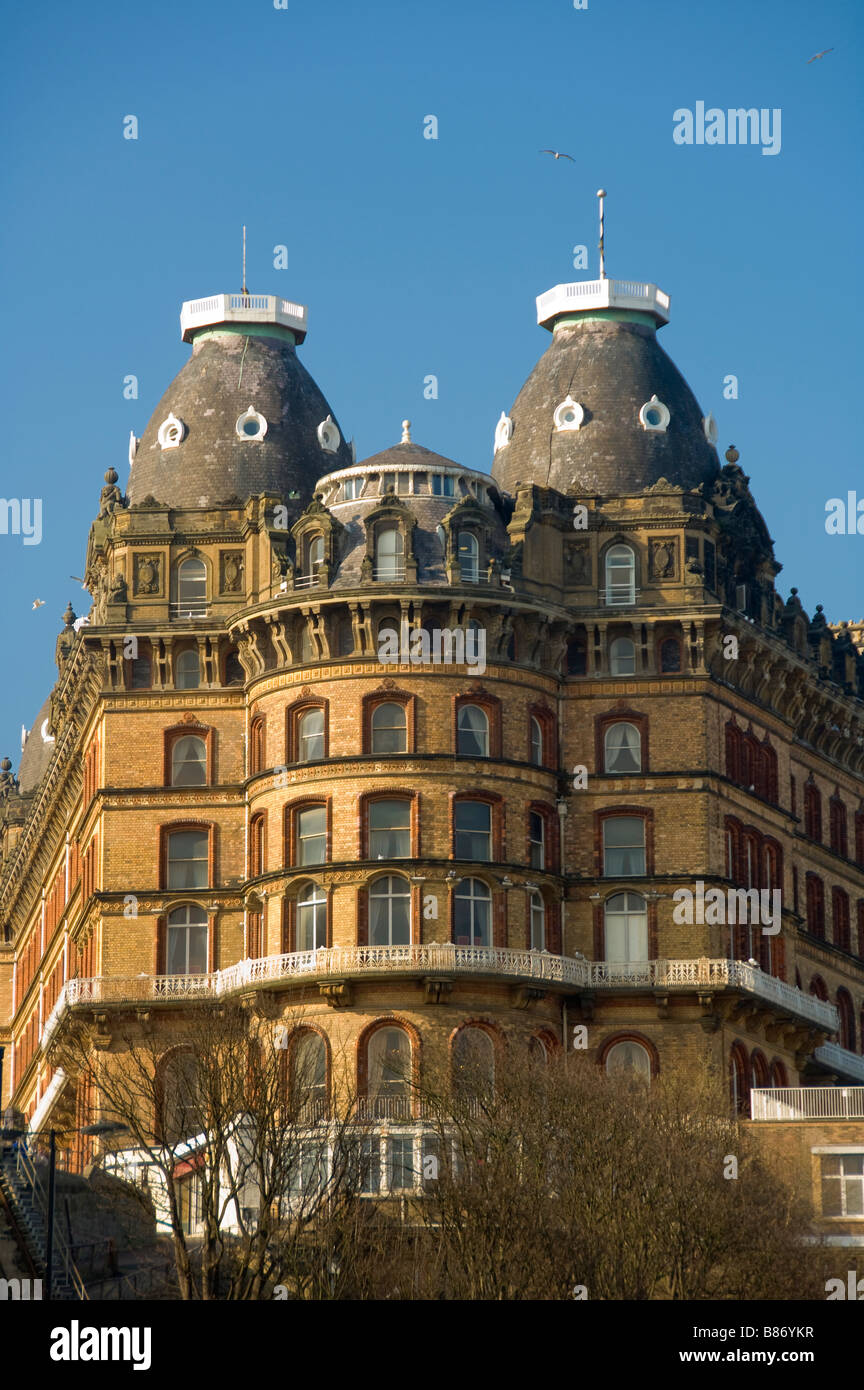 Exterior curved façade of The Grand Hotel in Scarborough with its decorative cornice and two of its four slate tiled cupolas. UK Stock Photo