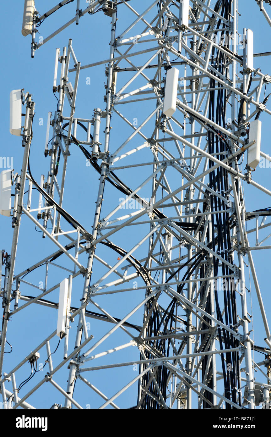 Graphic close up of a cell phone tower with antennas for cellular mobile phones with cables and metal grid work. USA Stock Photo