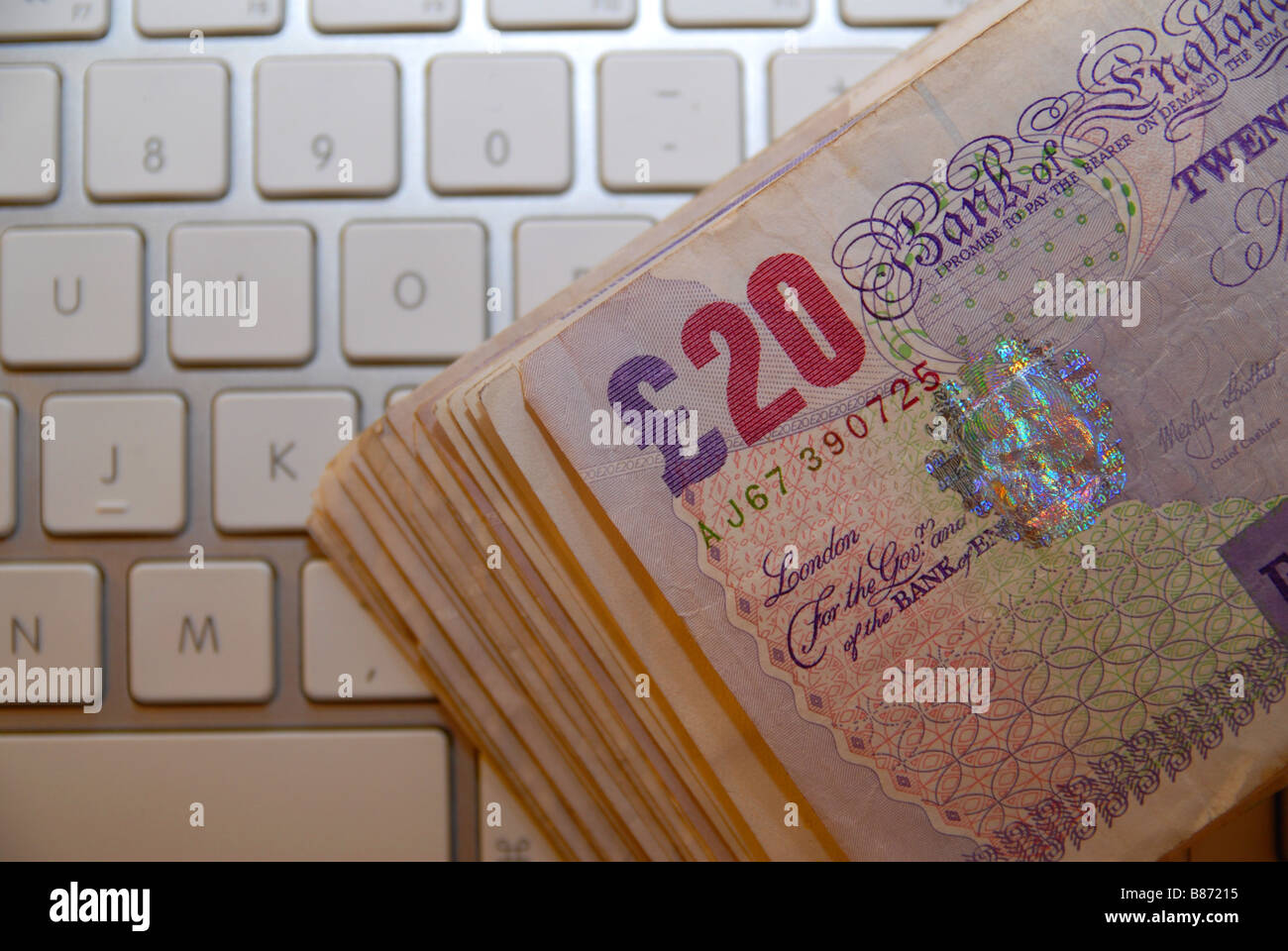 A stack / pile of used £20 Stirling bank notes, used notes ( currency