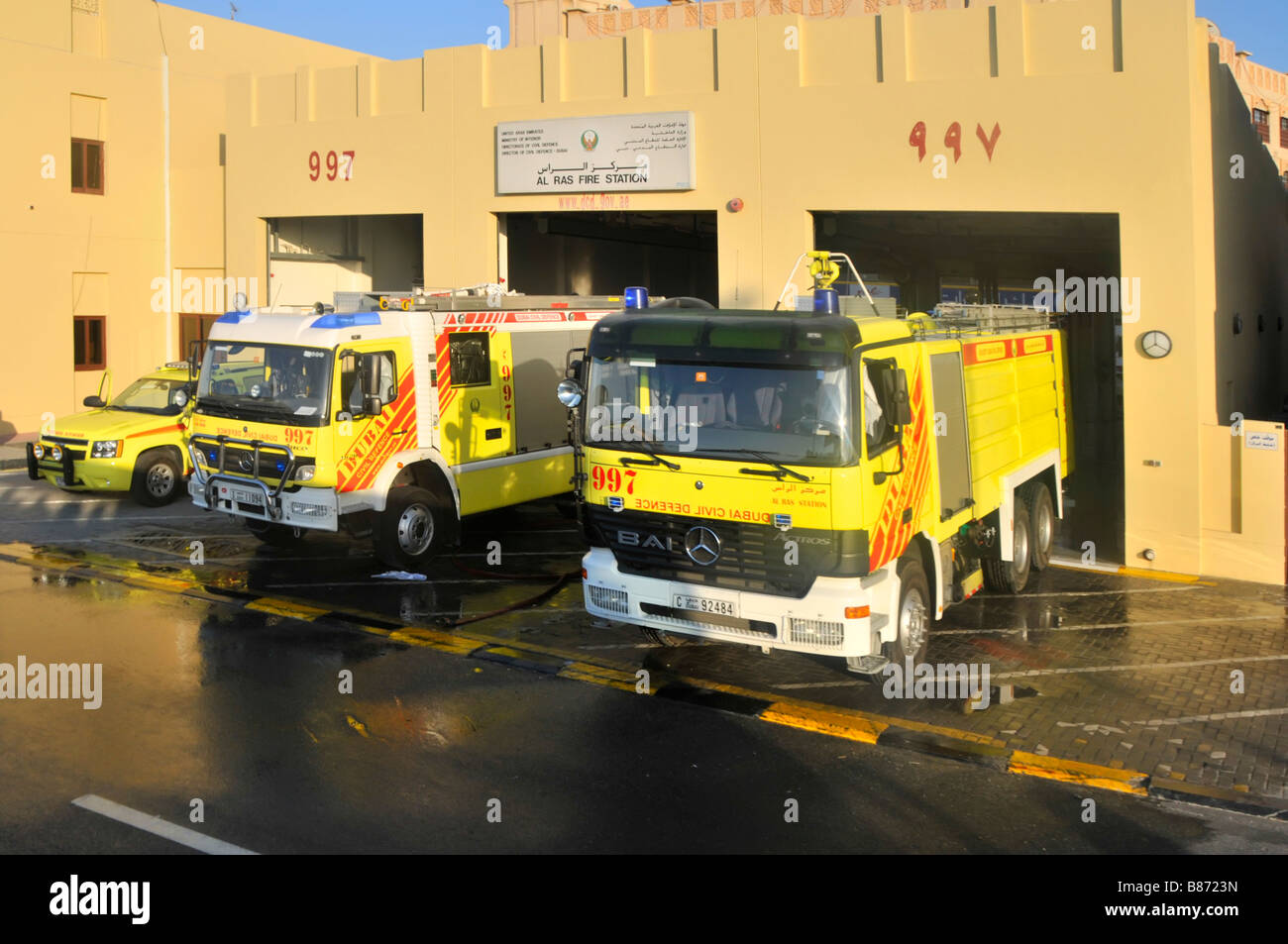 Dubai Al Ras firefighters fire engine station & Civil Defence fire truck vehicles outside fire station building United Arab Emirates UAE Middle East Stock Photo