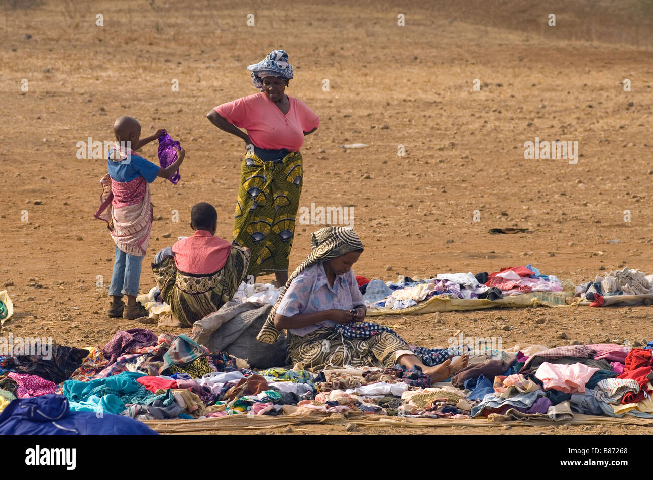 Woman selling second hand clothes at a weekly market in Makuyuni, Arusha Region, Tanzania Stock Photo