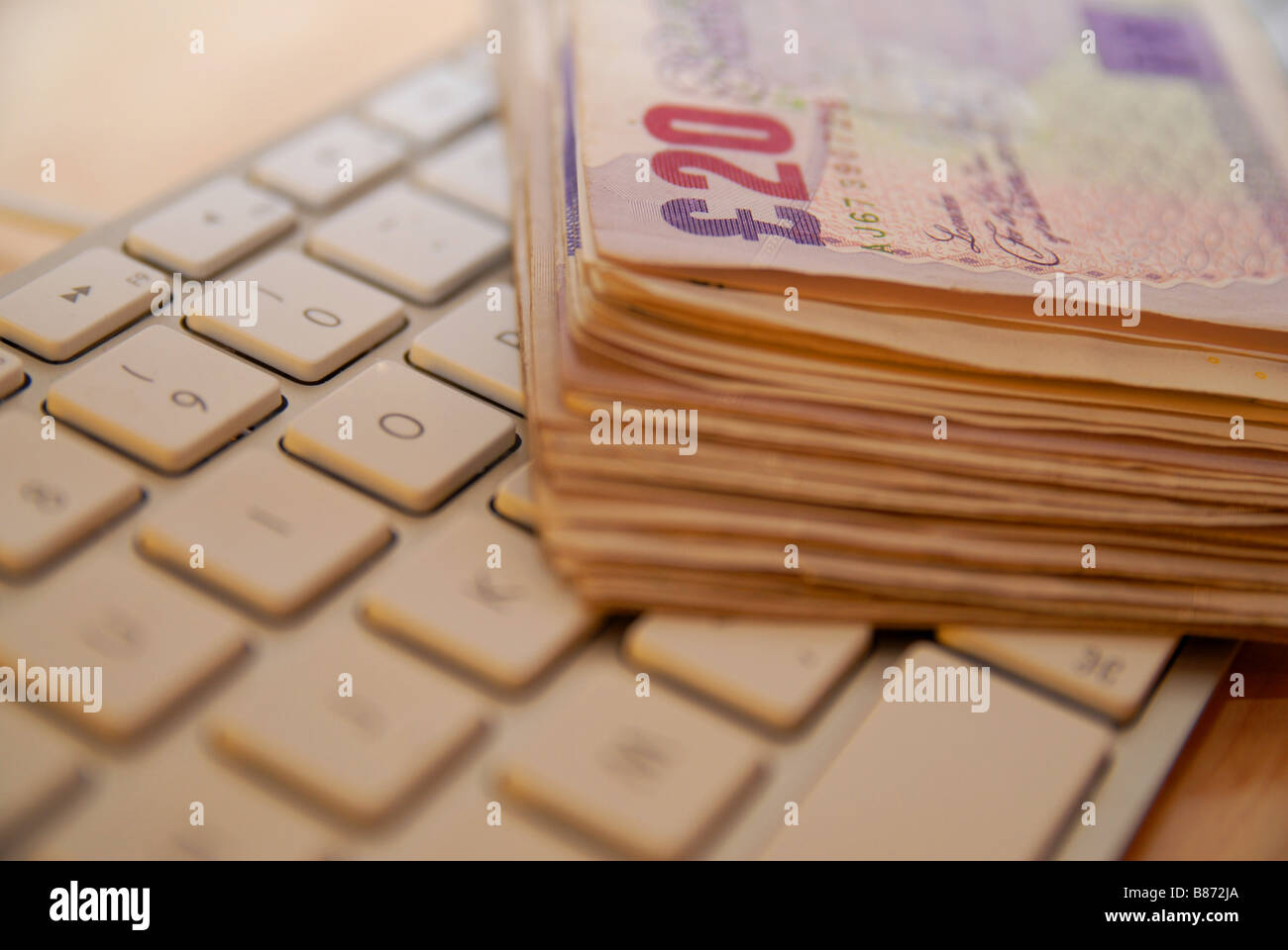A stack / pile of used £20 Stirling bank notes, used notes ( currency