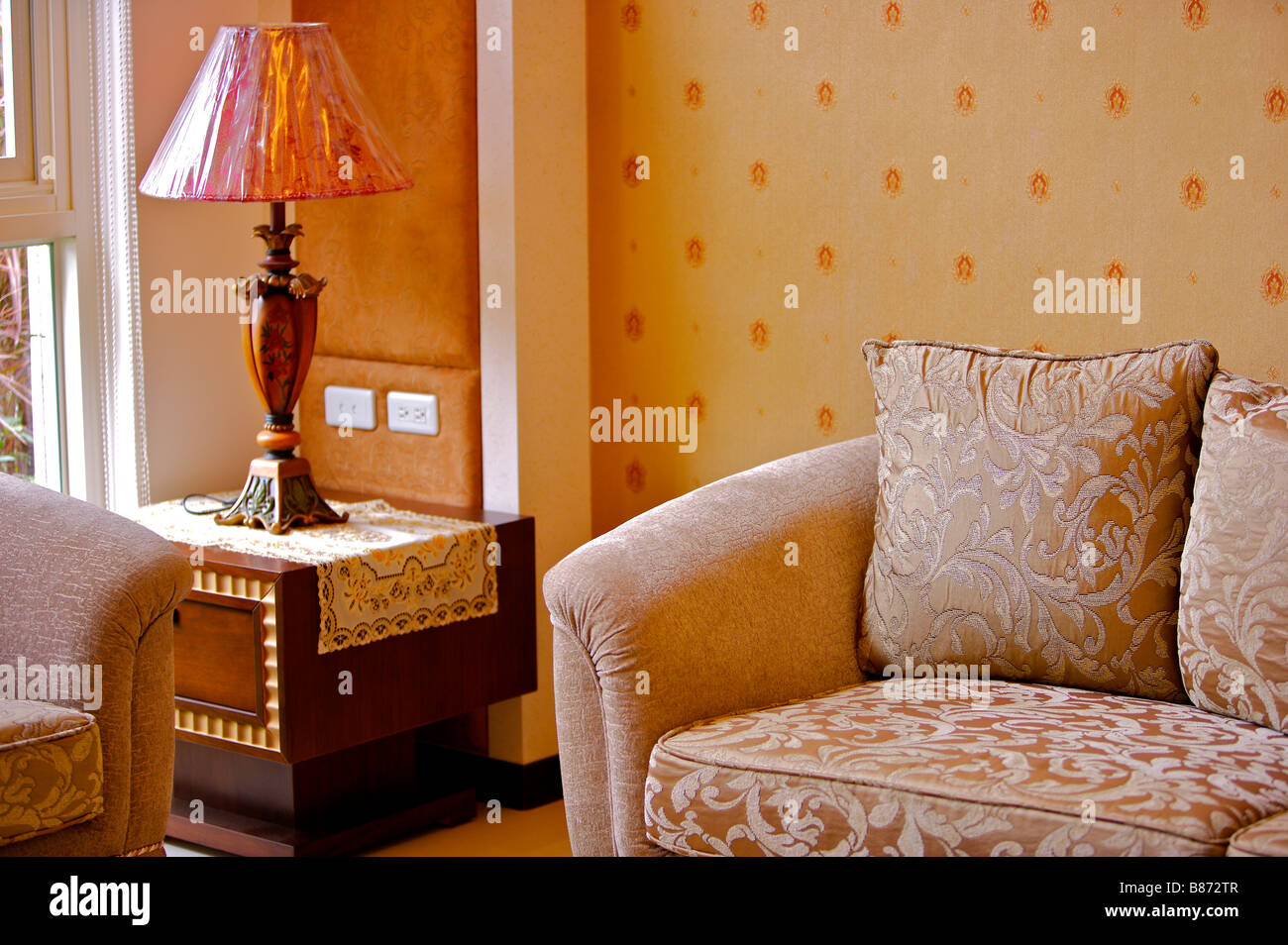 Lamp on side table by sofa Stock Photo Alamy