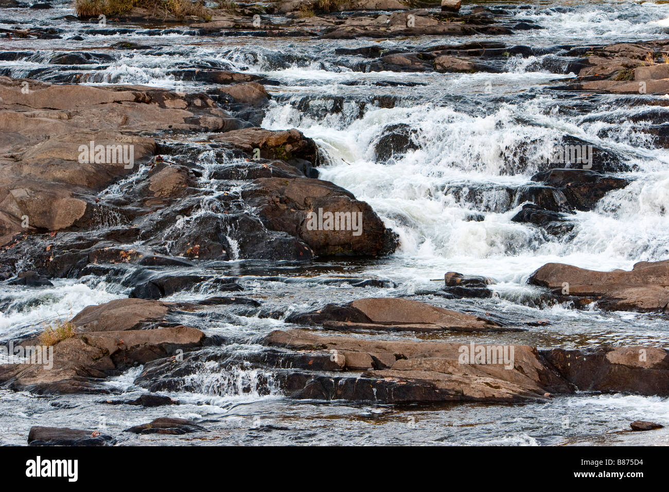 Whitewater clowing over rocks in Vermont October 10 2008 RF Stock Photo