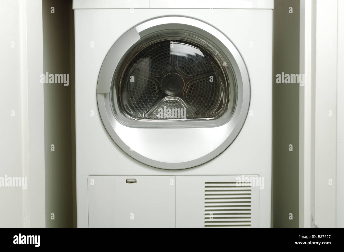 An empty laundry washing machine drying machine Stock Photo