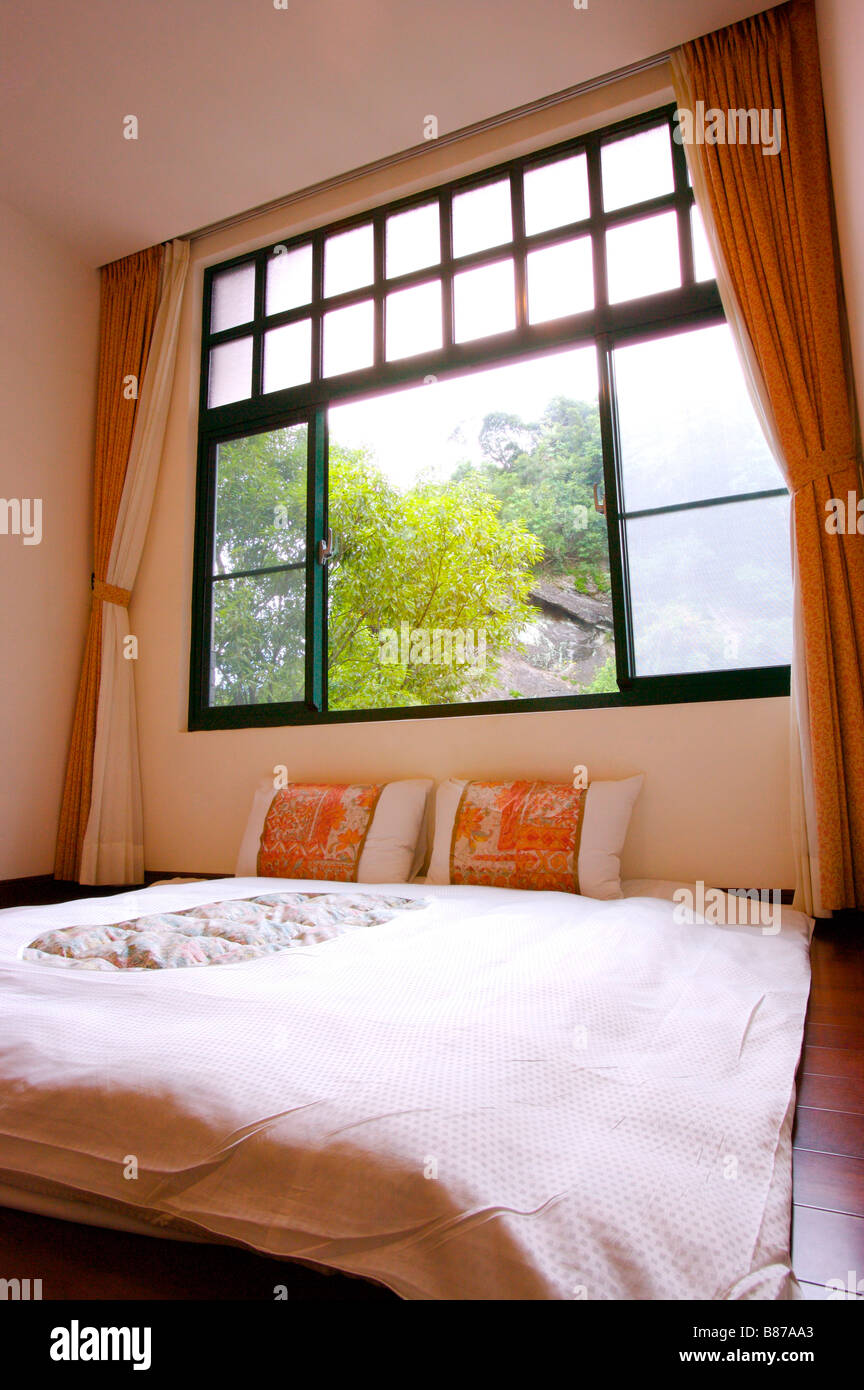 Bedroom with an open window Stock Photo - Alamy