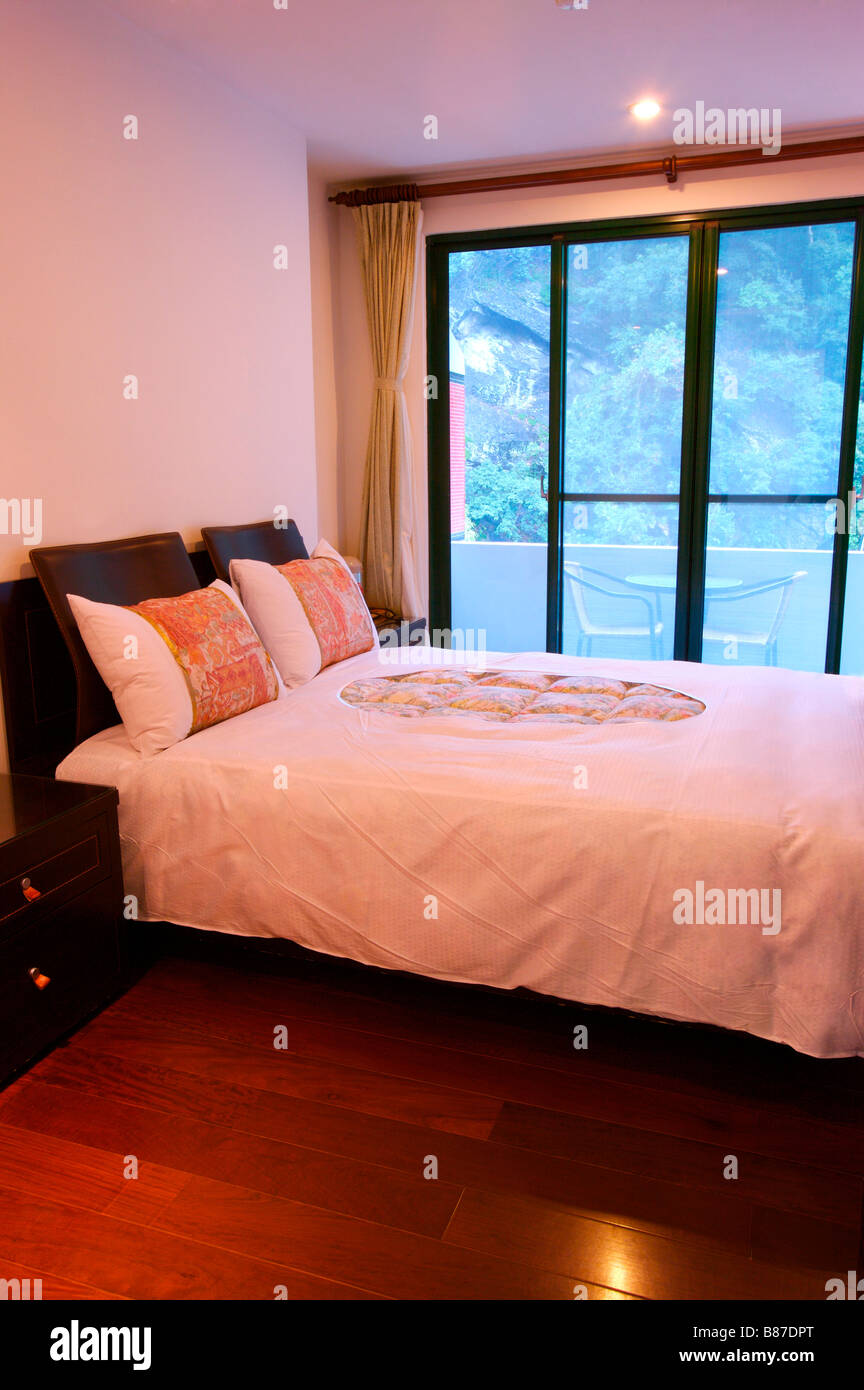 Bedroom with French window Stock Photo - Alamy