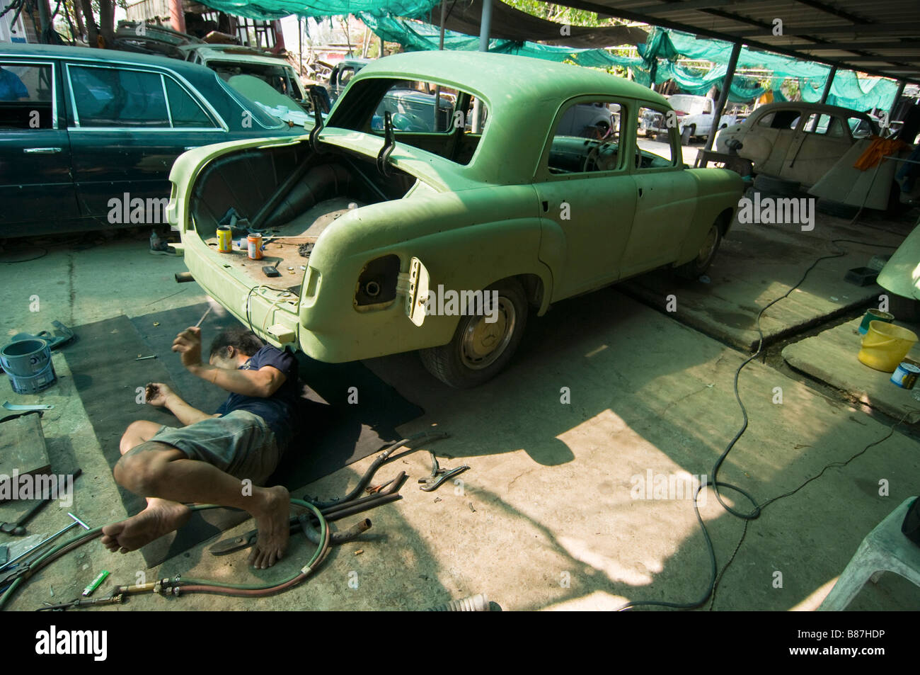 auto repair shop at the strange Wat Hua Krabeu in Bangkok Thailand