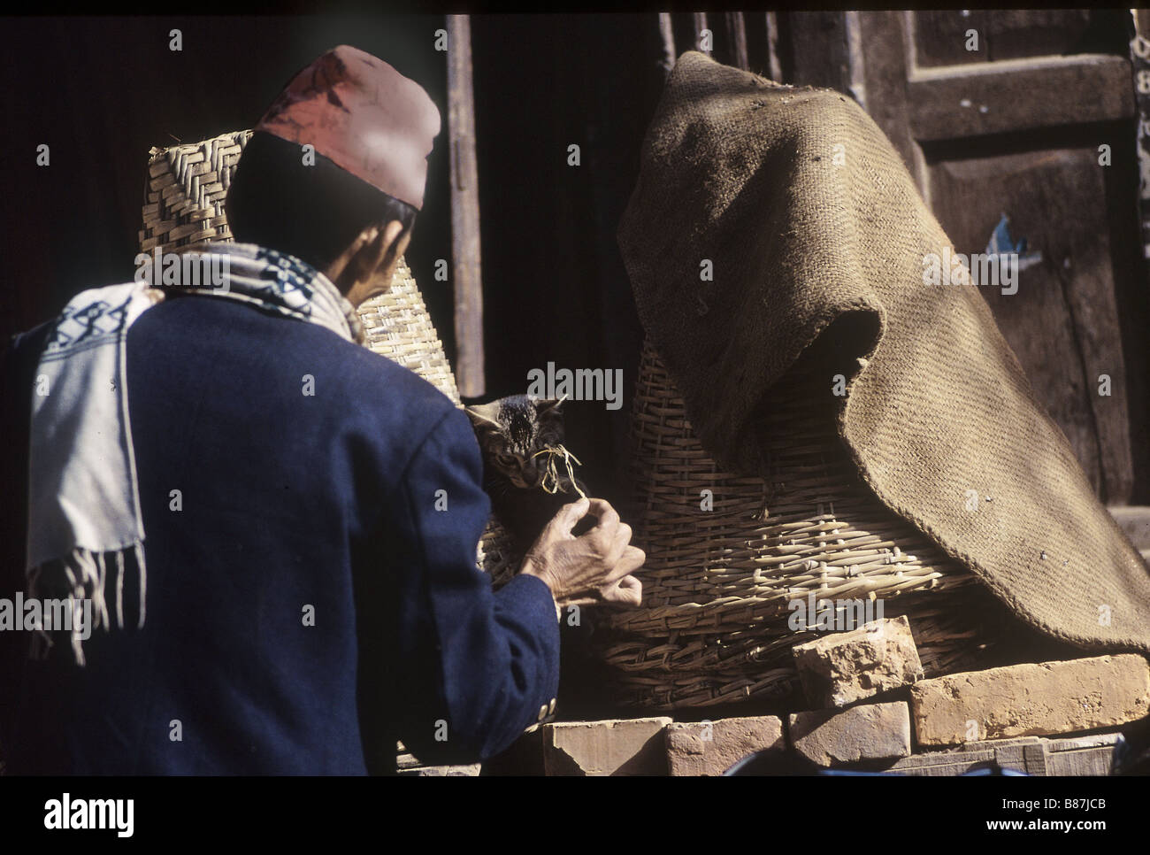Nepali man playing with cat kathmandu hires stock photography and images Alamy