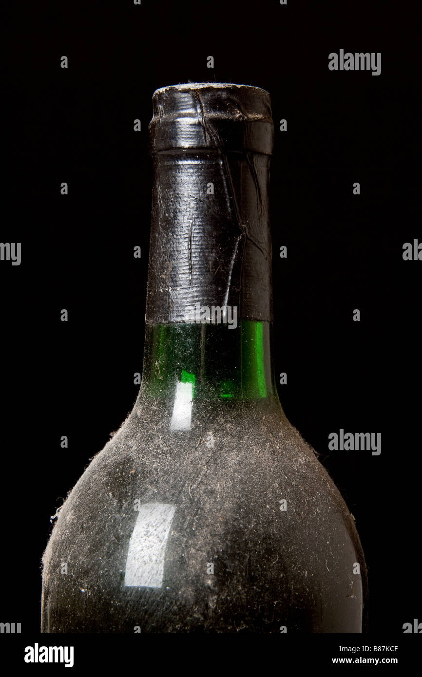 An old, dusty bottle of red wine Stock Photo Alamy