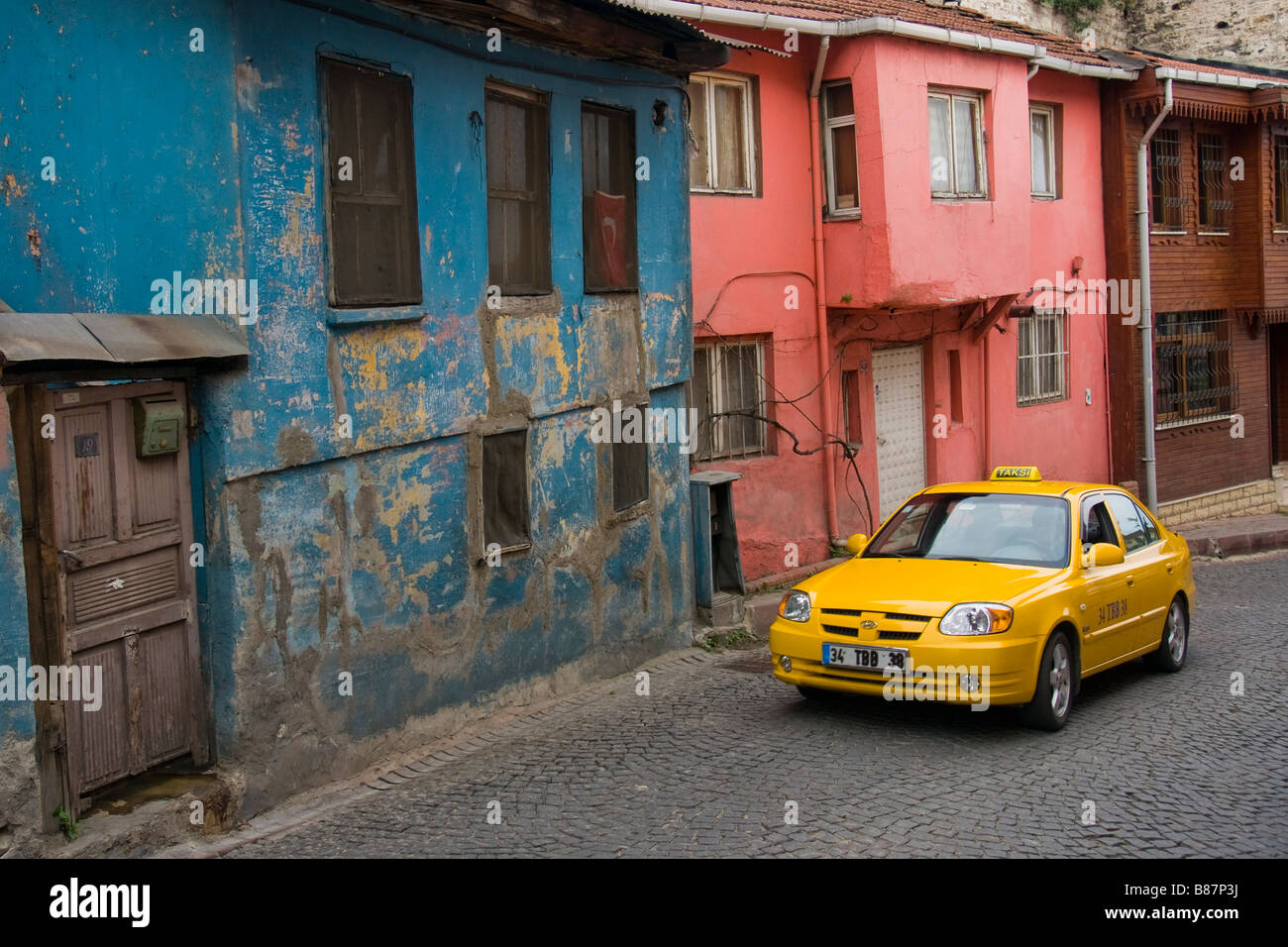A taxi in the back streets of Istanbul Stock Photo
