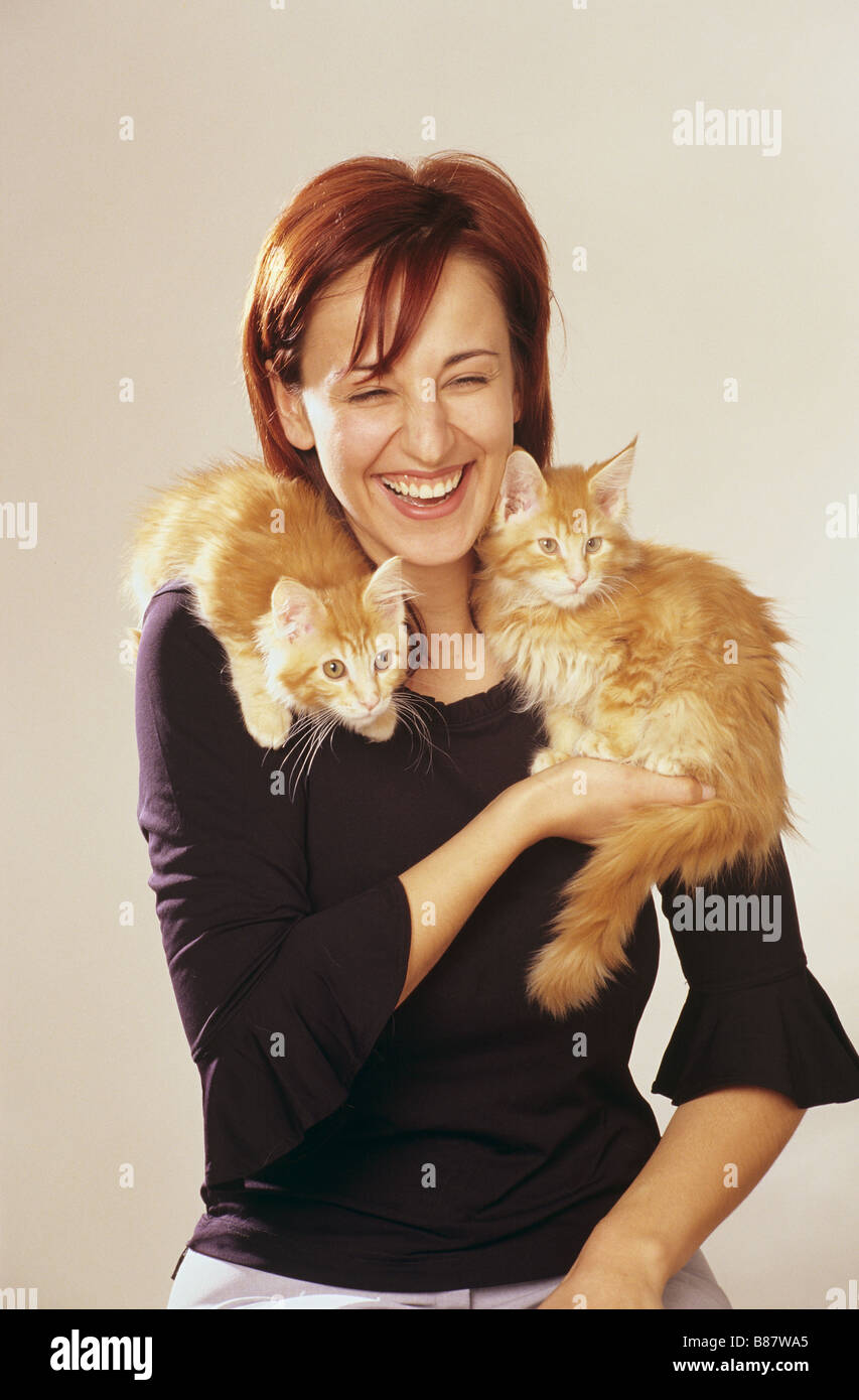 Woman with two domestic cats on shoulder Stock Photo - Alamy Woman with two domestic cats on shoulder Stock Photo - Alamy