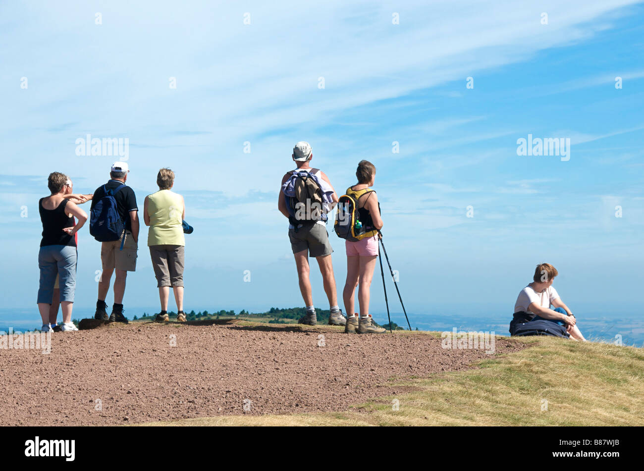 Group of people, tourists, looking at the valley landscape from the Puy de Dome, Auvergne, France Stock Photo
