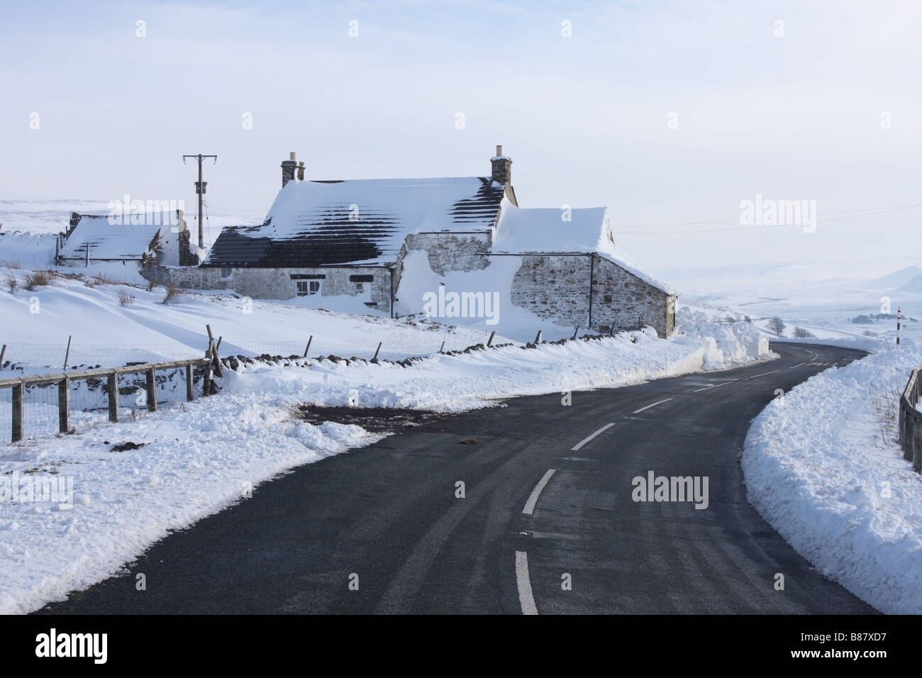 House and the B6277 Road in Winter Harwood Upper Teesdale County Durham Stock Photo