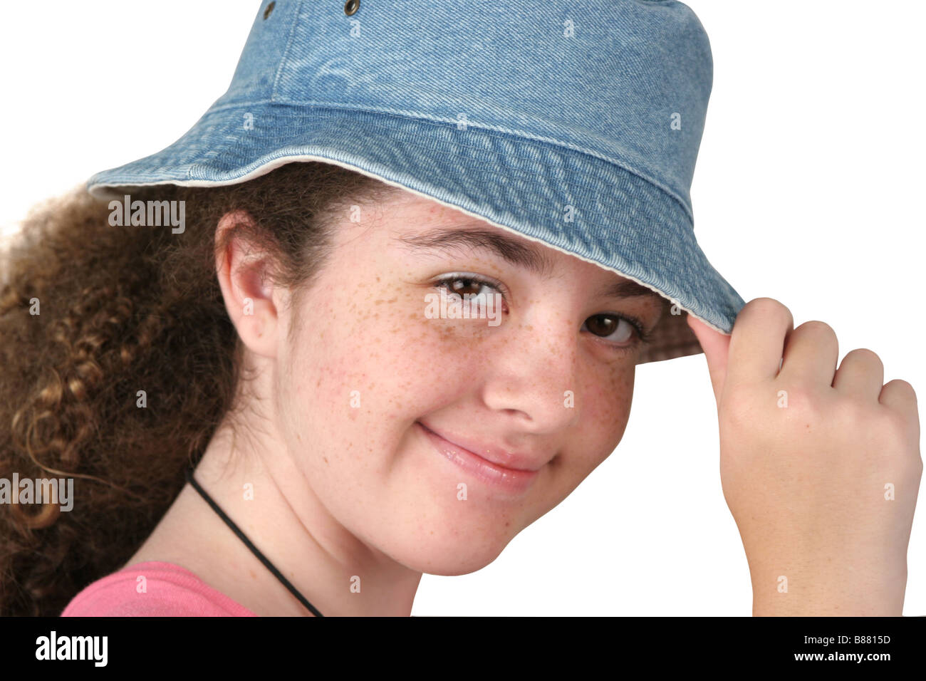 a cute teen girl tipping her hat isolated Stock Photo Alamy