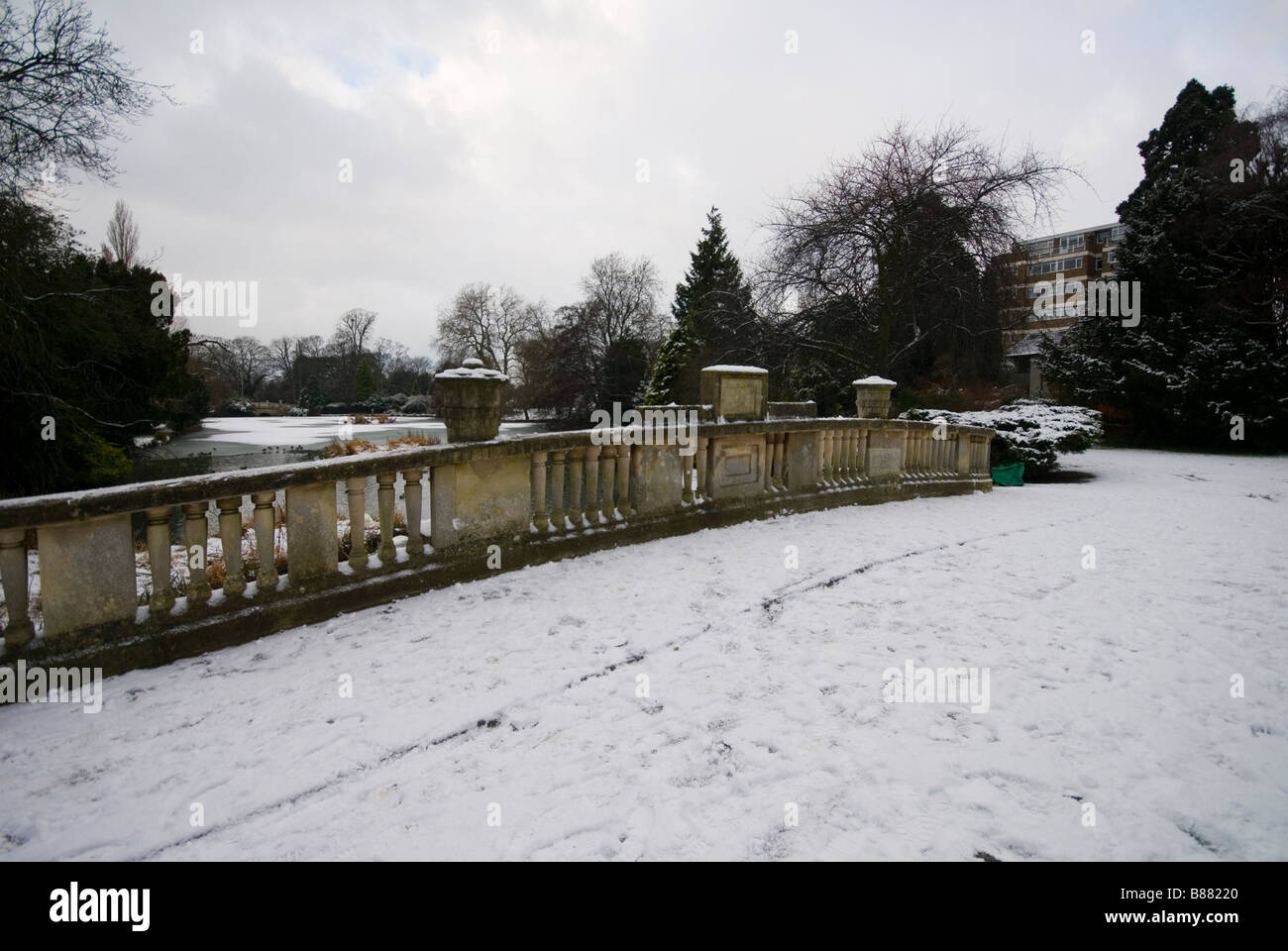 A snow covered bridge in Pittville Park, Cheltenham, gloucestershire. Stock Photo