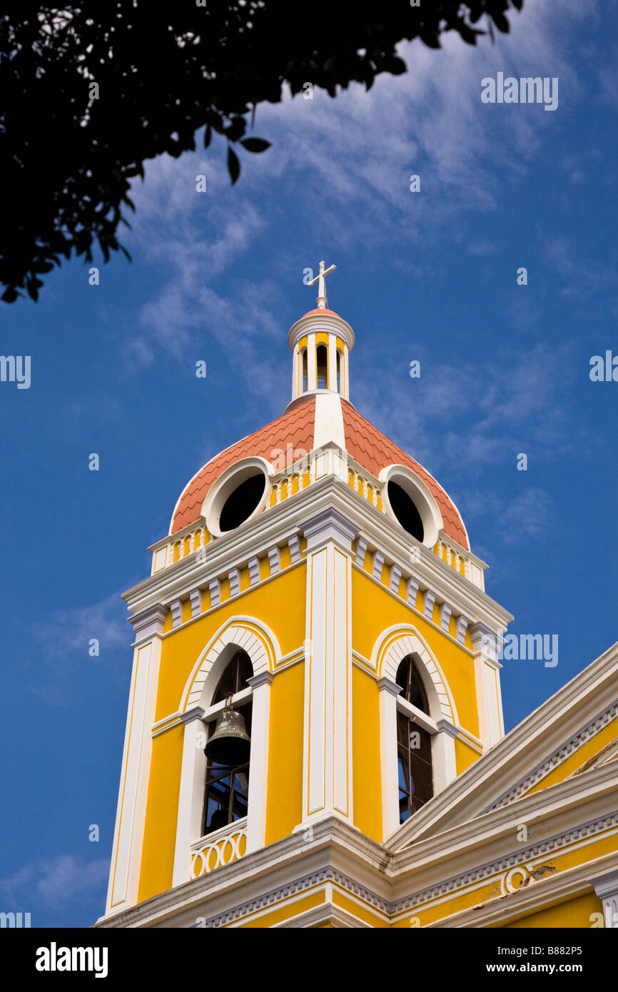 Yellow and red bell tower of the neoclassical Granada Cathedral or Our Lady of the Assumption Cathedral in Granada, Nicaragua. Stock Photo