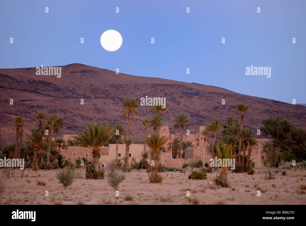 The full moon over a settlement in the Dades gorge night photograph Morocco Africa Stock Photo