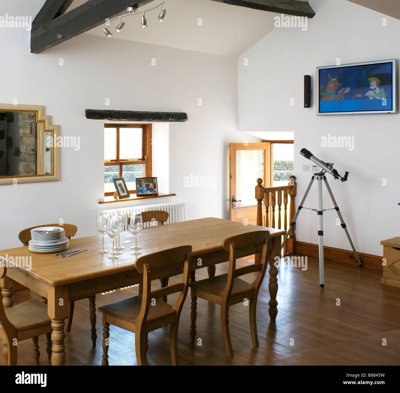 Dining Room With Wooden Dining Table And Chairs And