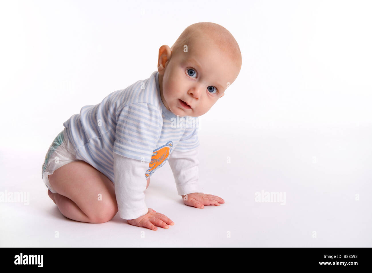 Portrait of a baby boy starting to crawl Stock Photo