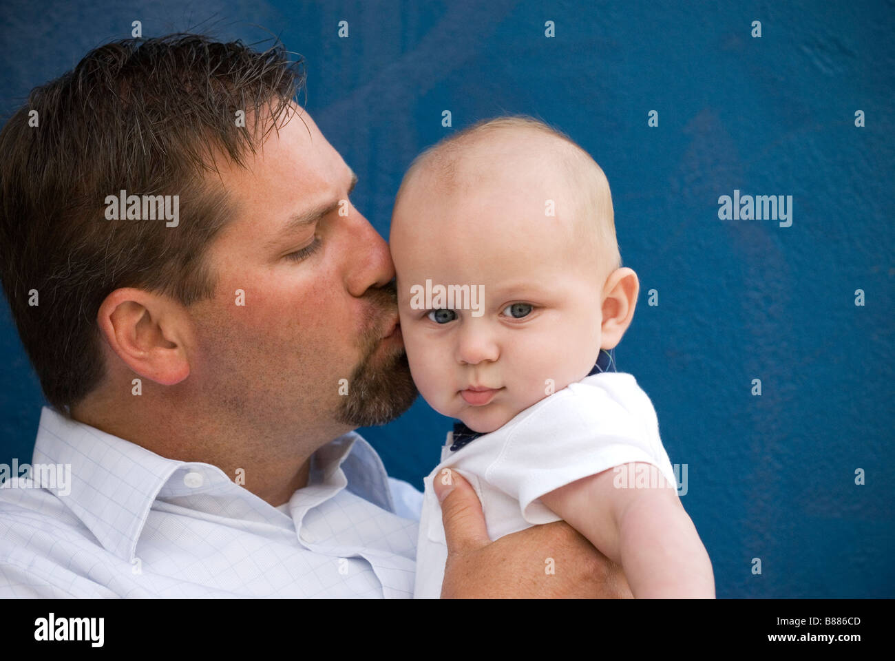 Father kissing his son. Fatherhood. Stock Photo