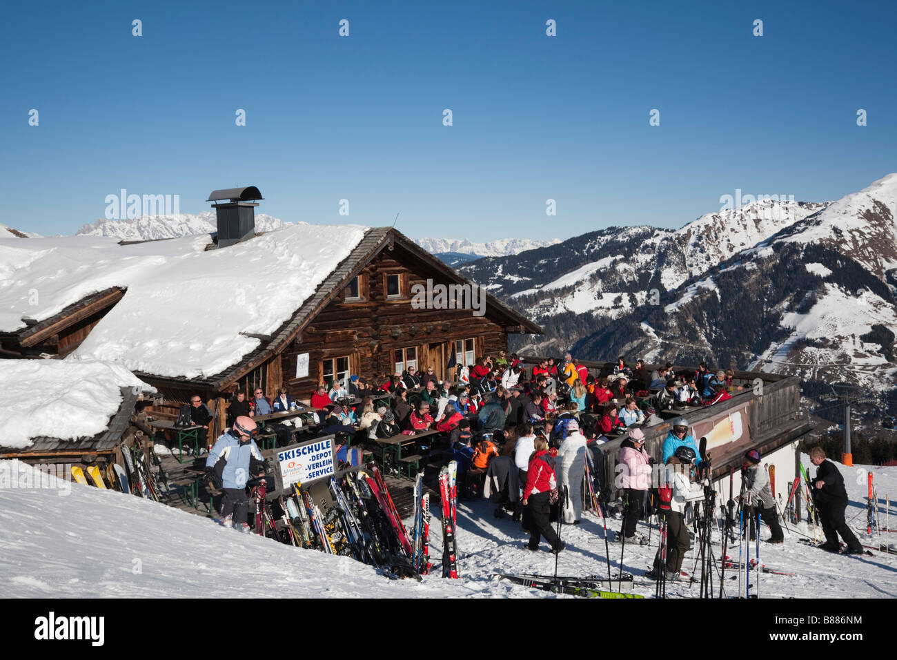 Rauris Austria January Skiers in Bergrestaurant wooden chalet on pistes in ski resort in Austrian Alps in winter snow Stock Photo
