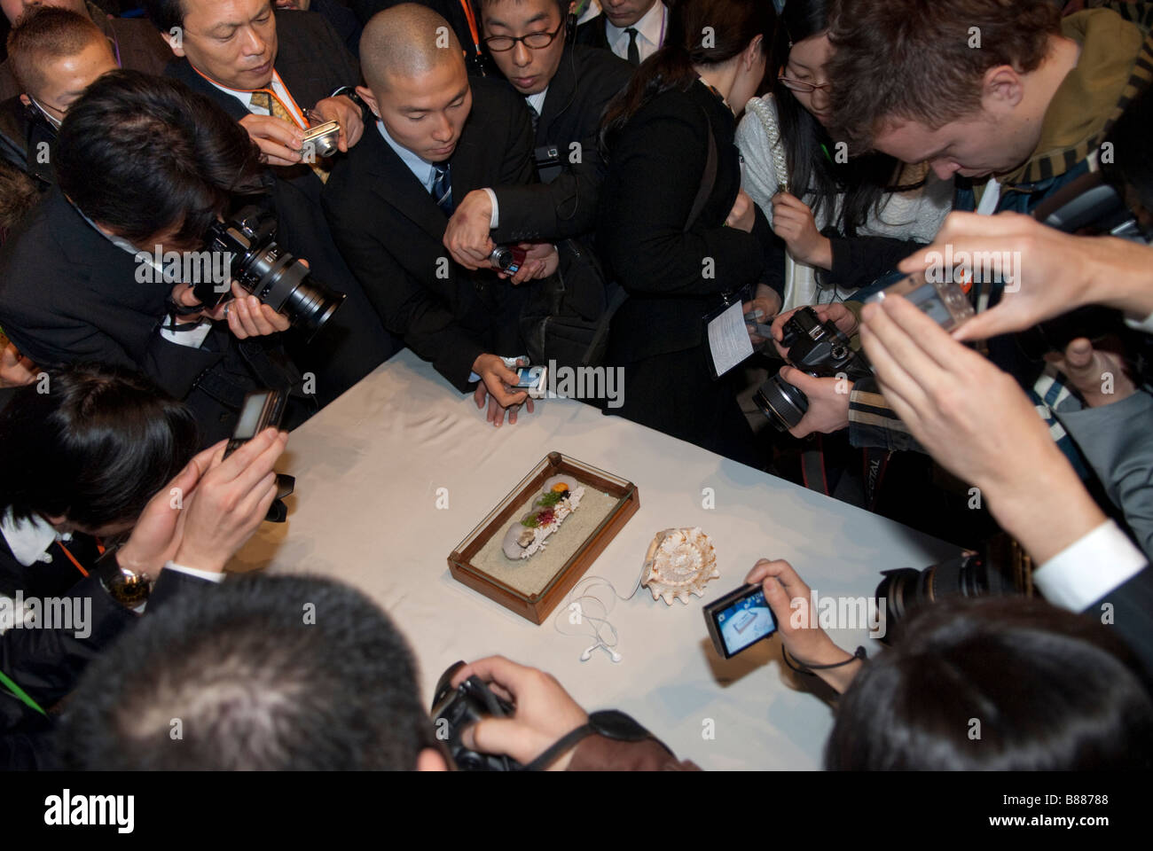 Audience members photograph a creation by chef Heston Blumenthal at Tokyo Taste: The World Summit of Gastronomy 2009. Stock Photo