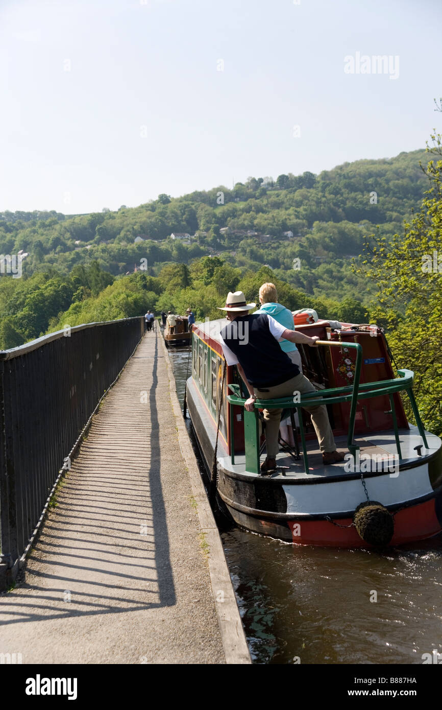 Narrow boat crossing the Pontcysyllte viaduct on the Llangollen Canal ...