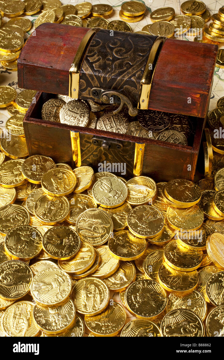 Gold box and gold coins Stock Photo Alamy