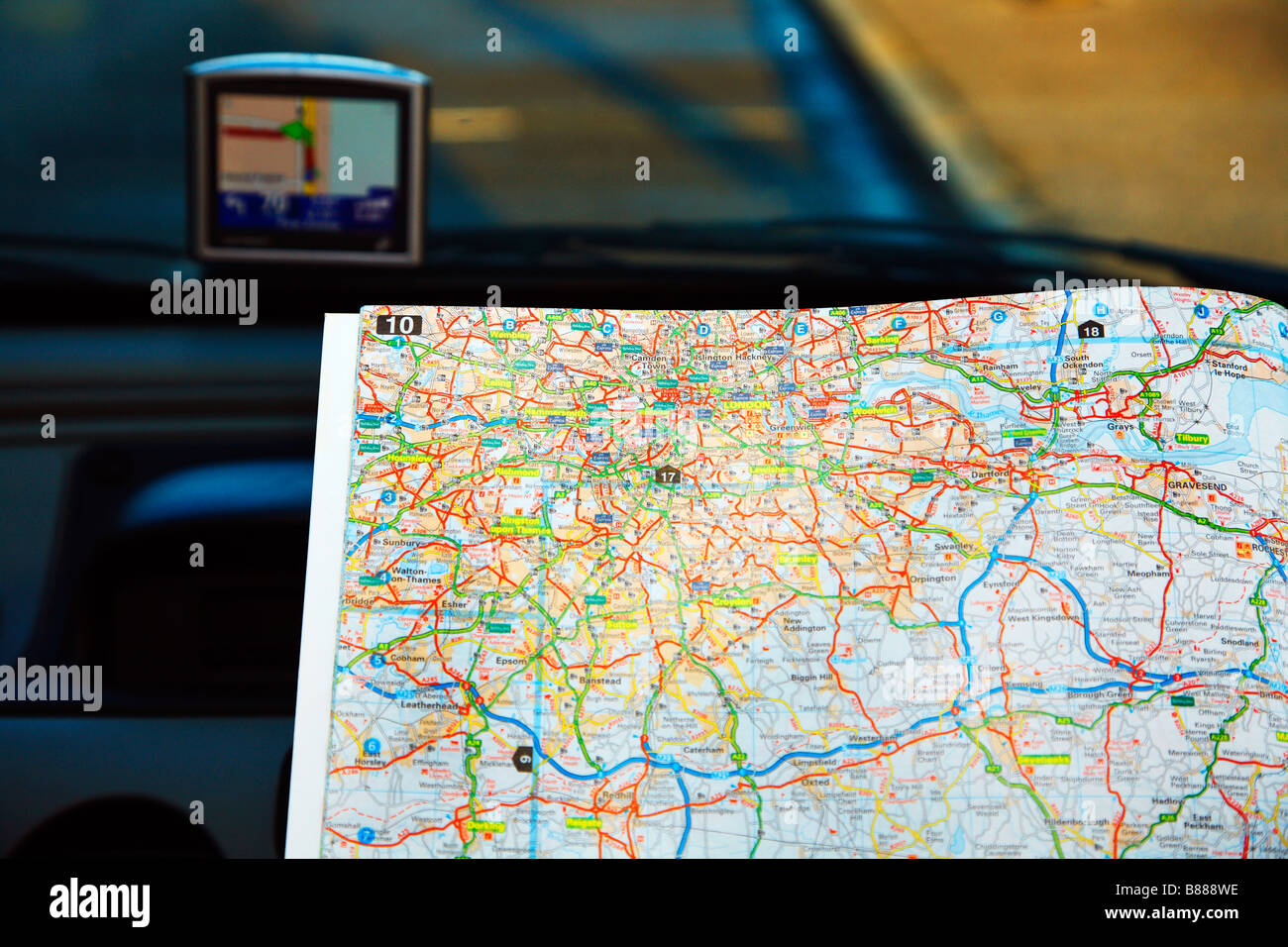 Road Map and Sat Nav in a car Stock Photo