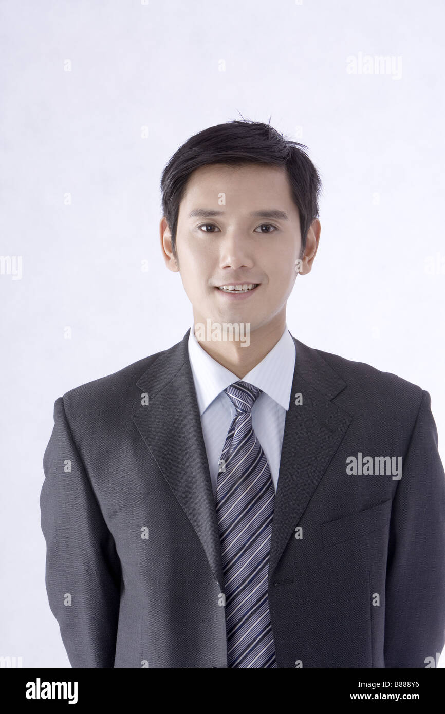 Young businessman in formalwear smiling portrait Stock Photo