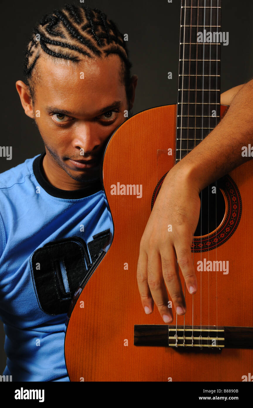 Portrait of young trendy african man with acoustic guitar Stock Photo ...