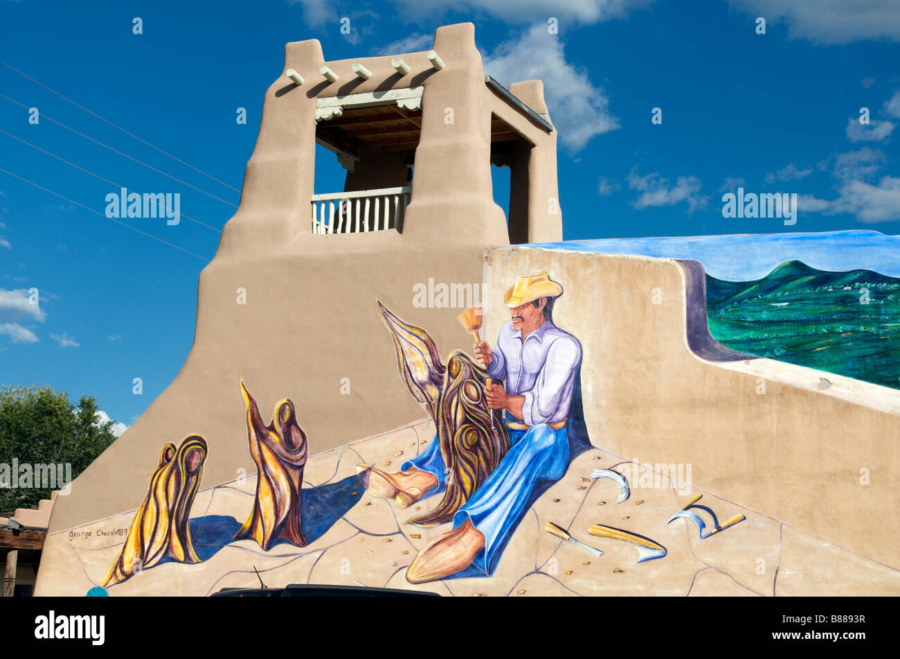 Typical adobe architecture with Indian wall art Taos New Mexico USA Stock Photo