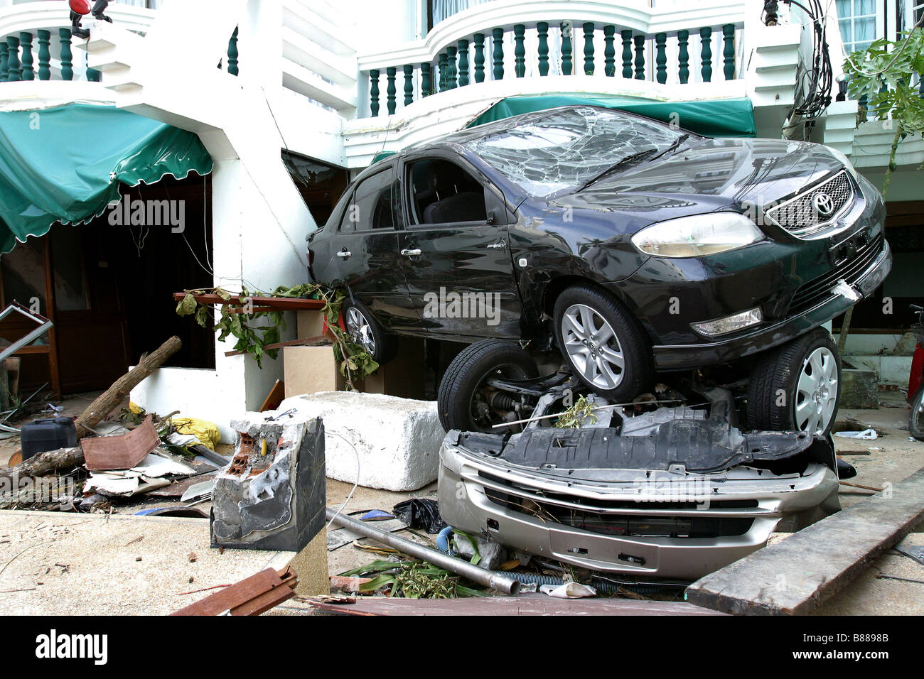 Debris and vehicles line the streets after the December 26, 2004 tsunami hit Patong Beach on Phuket Island, Thailand. Stock Photo