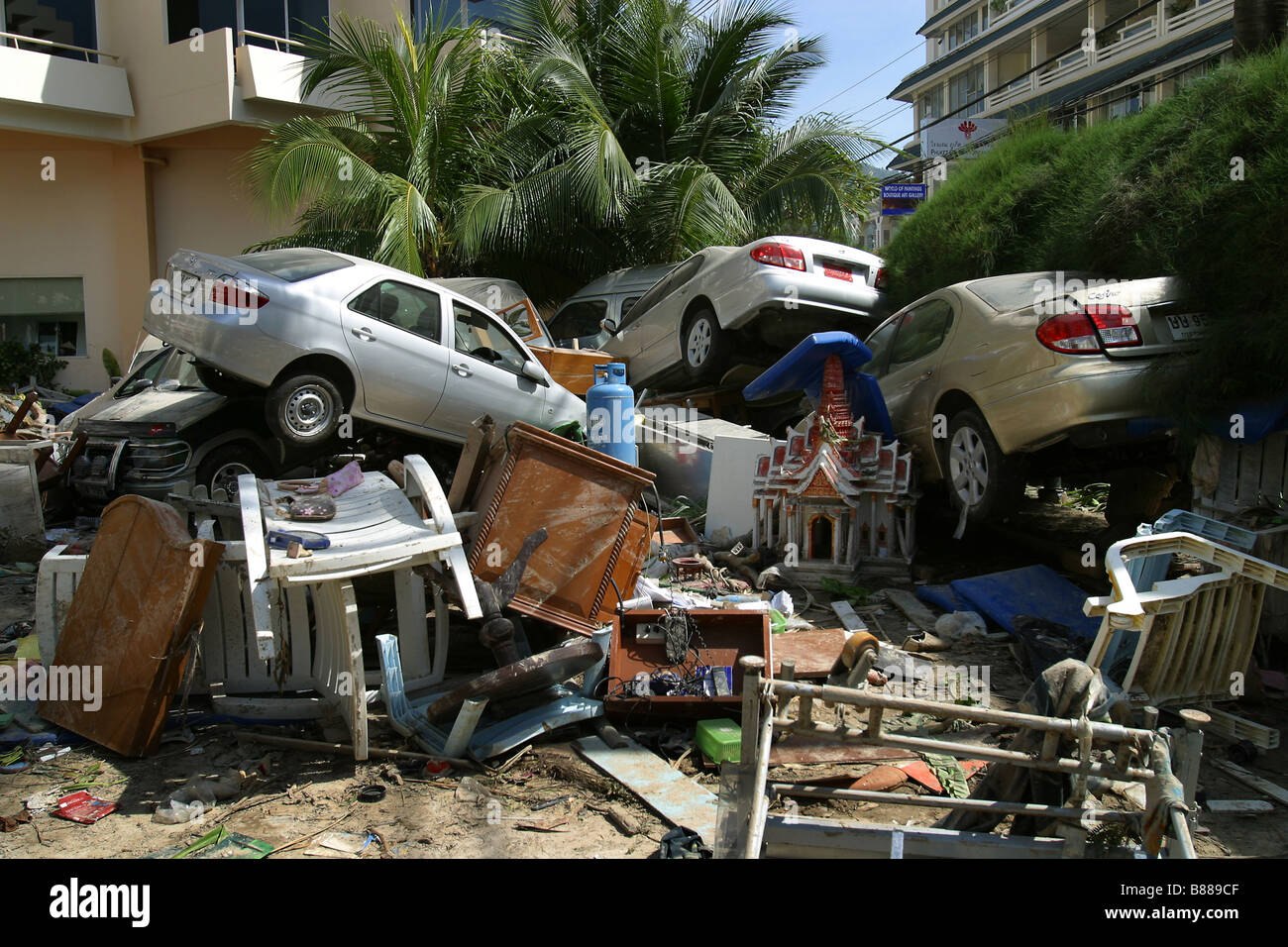 Vehicles piled up in a Holiday Inn parking lot after the December 26, 2004 tsunami hit Patong Beach on Phuket Island, Thailand. Stock Photo
