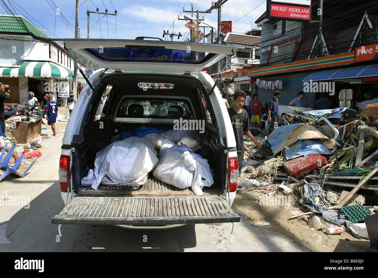 Dead bodies are collected in the back of a truck at Patong Beach, Phuket Island, Thailand after the December 26, 2004 tsunami. Stock Photo