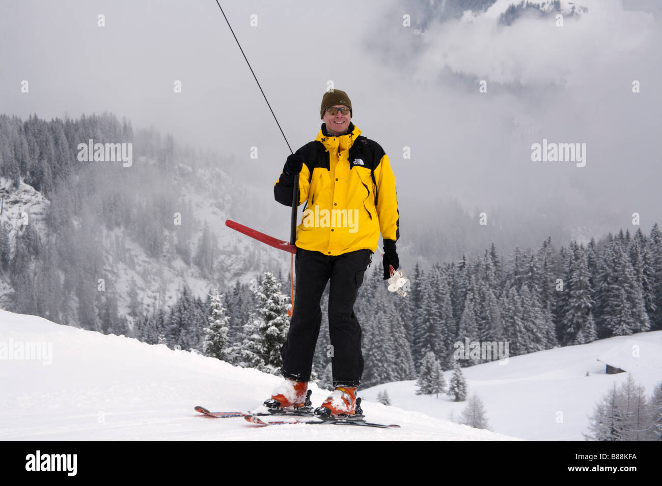 Rauris Austria Europe Skier on a T-bar ski tow high on mountain in resort in Austrian Alps in winter Rauriser Hochalmbahnen Stock Photo