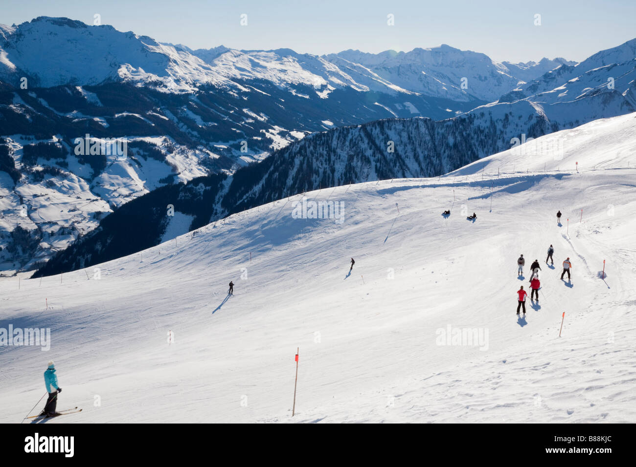Rauriser Hochalmbahnen ski slope piste in ski resort in Austrian Alps in winter. Distant mountains in Nationalpark Hohe Tauern. Rauris Austria Europe Stock Photo