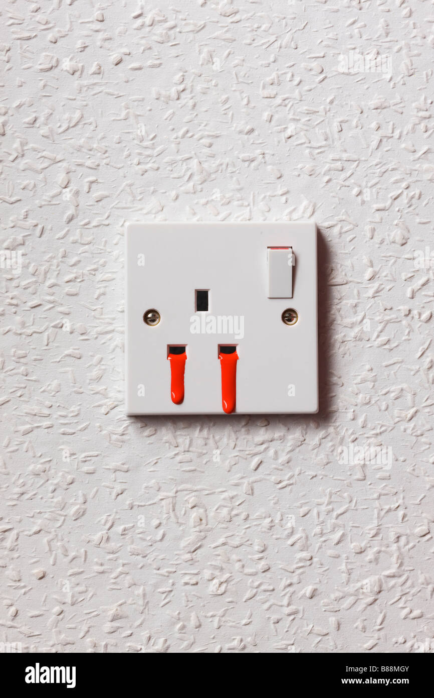 Bleeding UK mains electricity plug socket Stock Photo Alamy