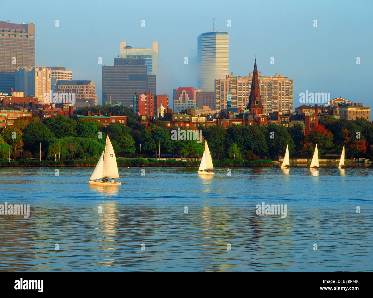 Sailboats on Charles River below Boston skyline at dawn Stock Photo Alamy