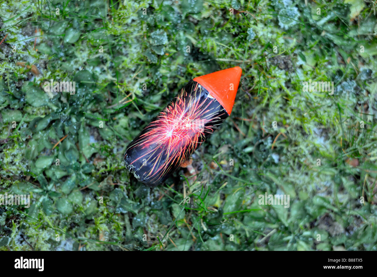 rocket firework lawn grass winter cold after the party new years day germany deutschland Stock Photo